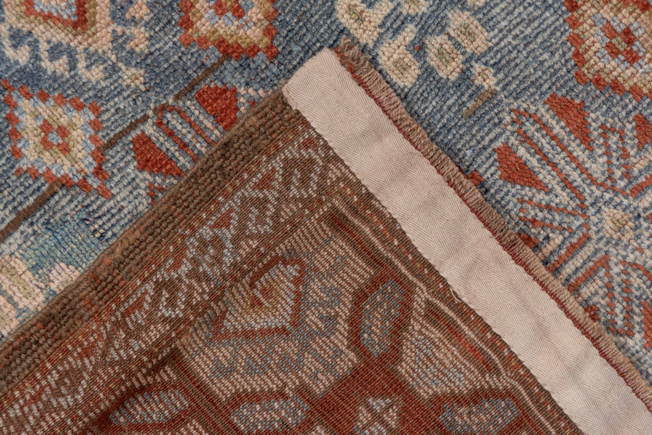 4' x 9' one-of-a-kind handmade antique Caucasian runner rug. Color palette: blue, ivory, rust, taupe, slate, camel