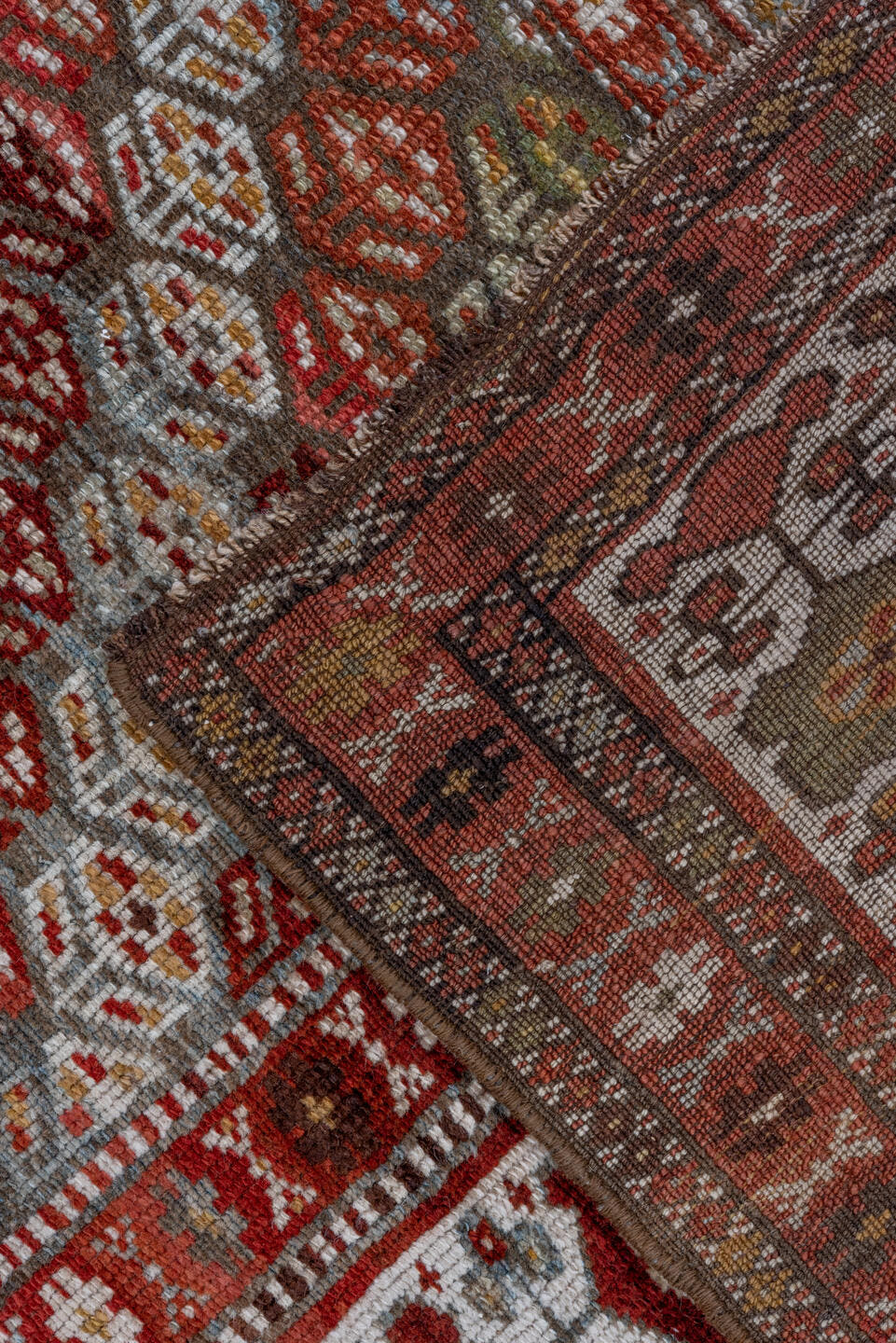 3' x 7' one-of-a-kind handmade antique Kurd rug. Color palette: rust, ivory, sky blue, camel, olive, brown, brick, slate