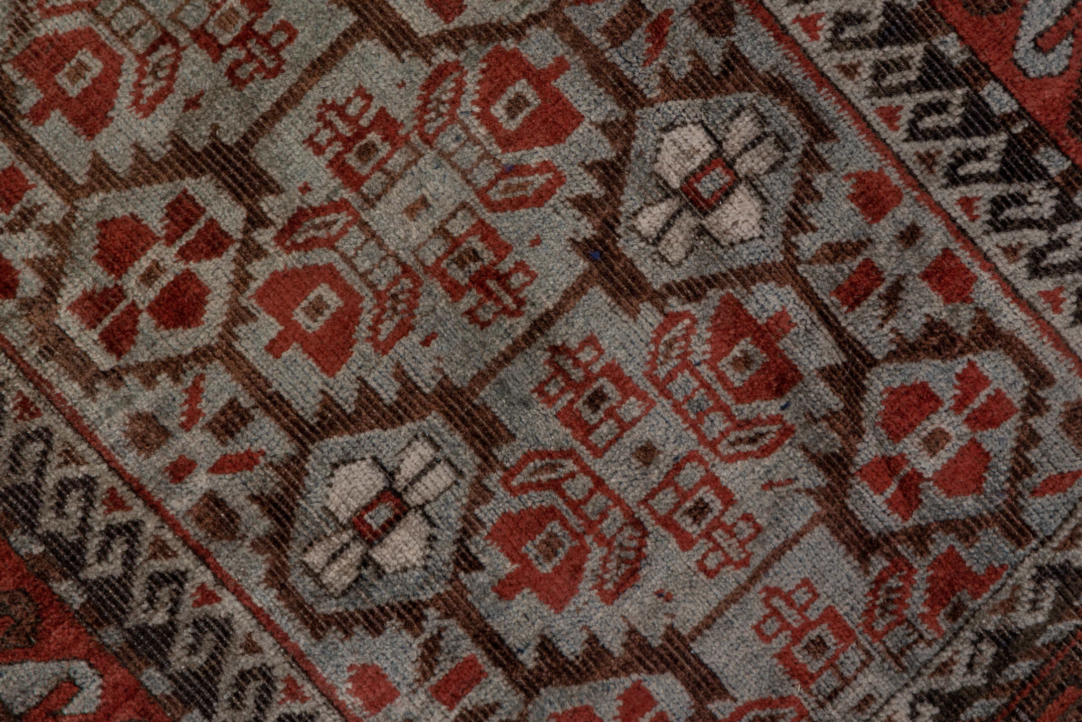 2' x 5' one-of-a-kind handmade antique Belouch small size rug. Color palette: rust, ivory, brown, camel, charcoal