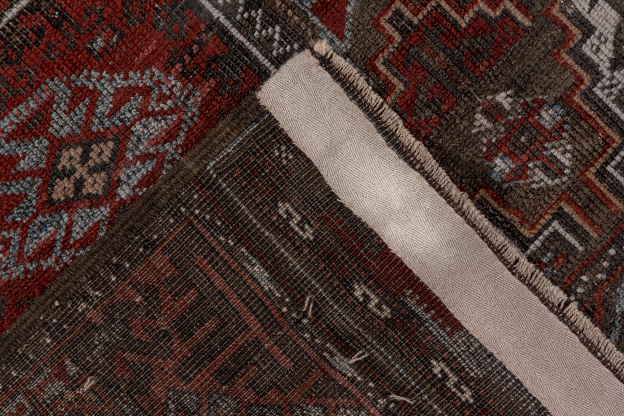 3' x 6' one-of-a-kind handmade vintage Belouch small size rug. Color palette: brown, gray, pink, red, redwood