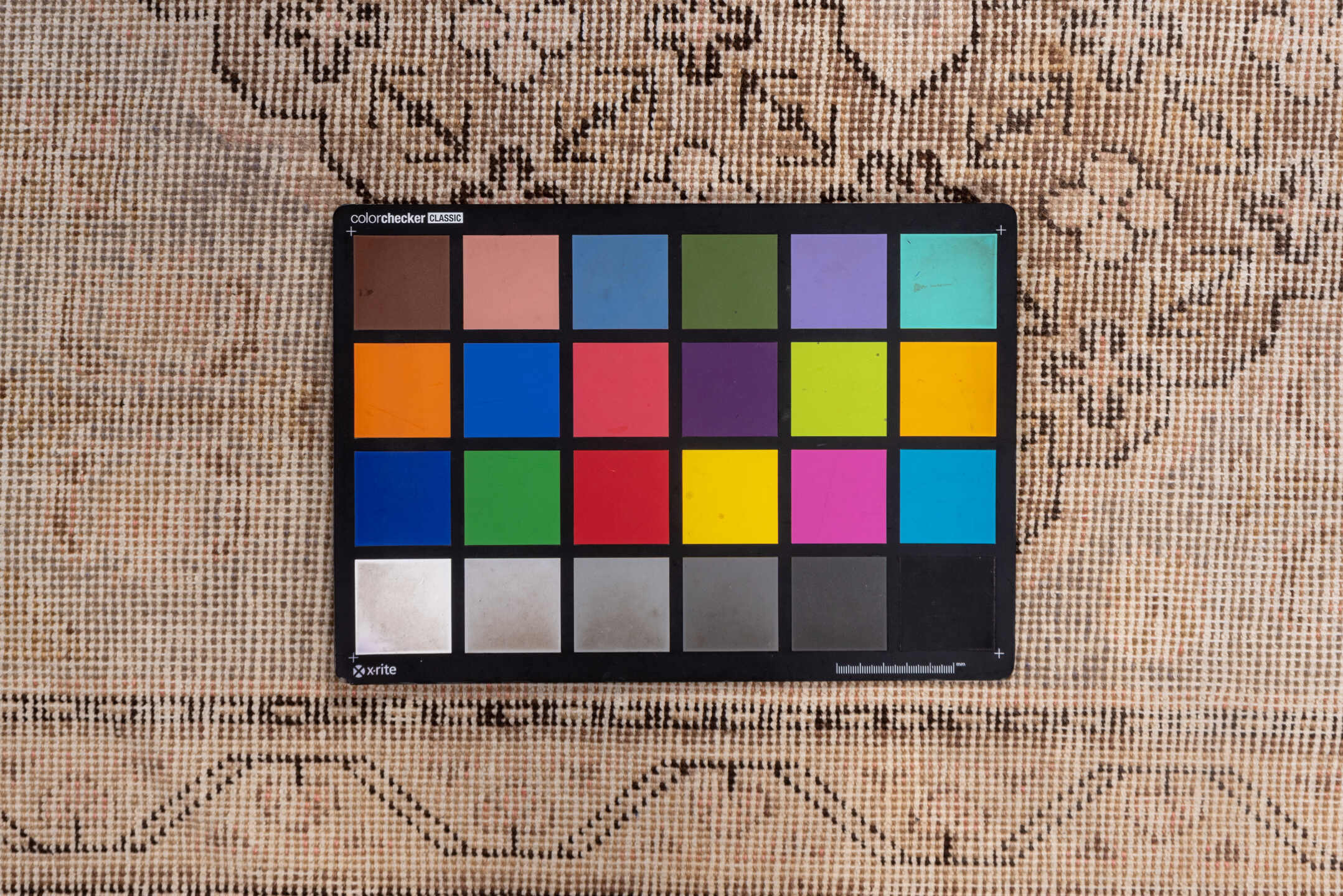 4' x 7' one-of-a-kind handmade vintage Khotan rug. Color palette: brown, gray, light gray, off-white, orange, pink, snow