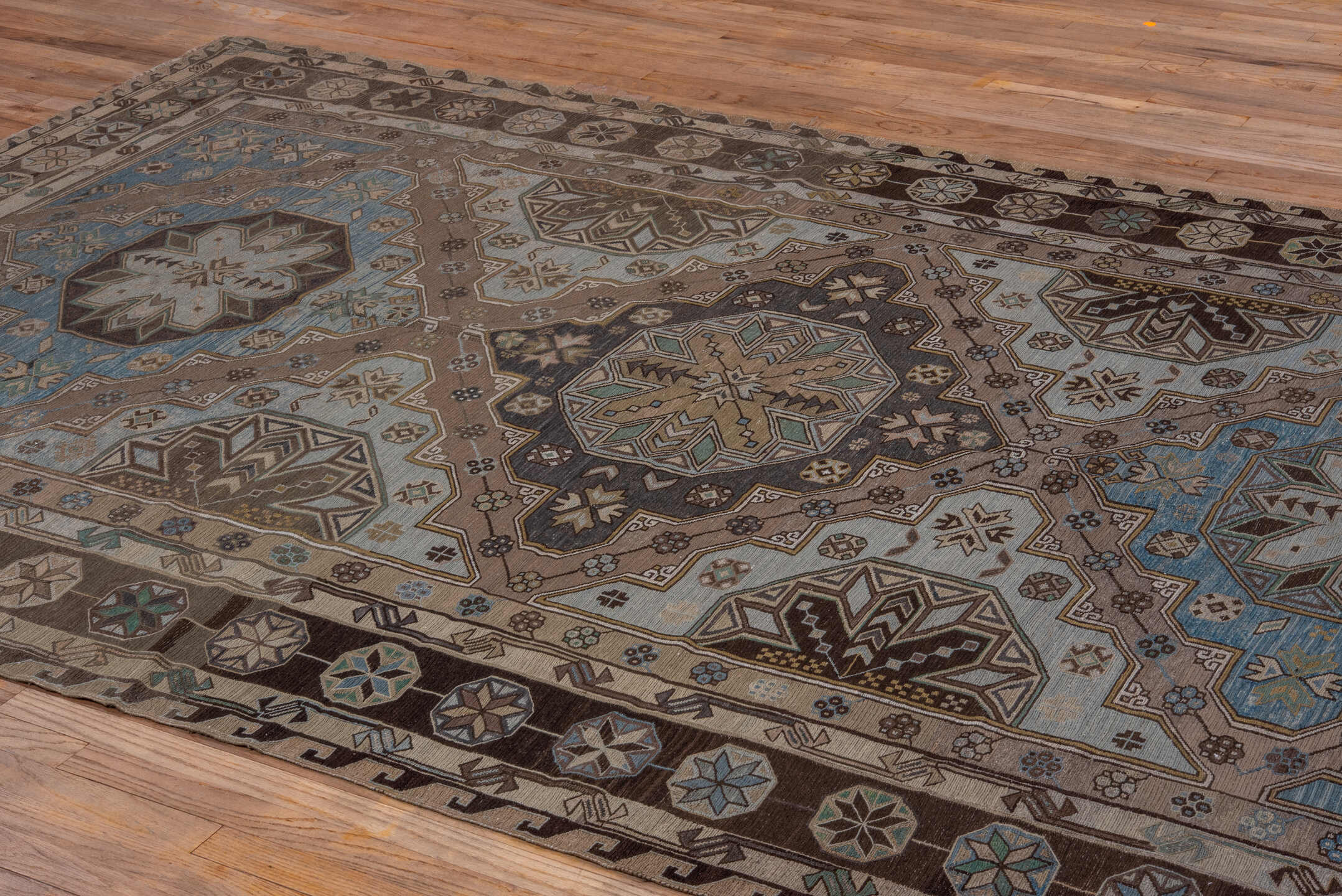 7' x 11' one-of-a-kind handmade antique Sumak large size rug. Color palette: taupe, brown, sky_blue, ivory, camel, charcoal