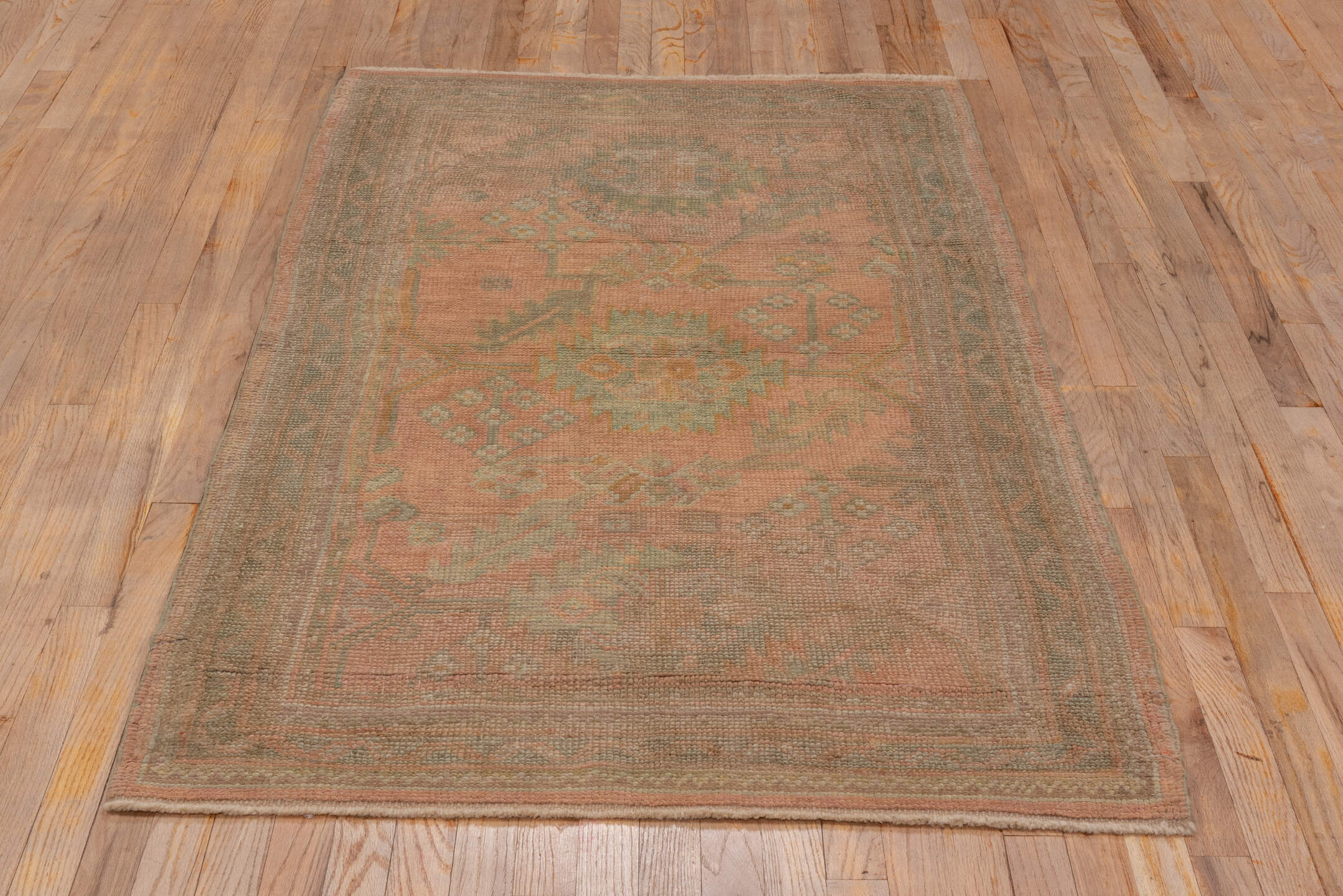 3' x 6' one-of-a-kind handmade antique Oushak small size rug. Color palette: rose, taupe, sage, ivory, ochre, terra cotta
