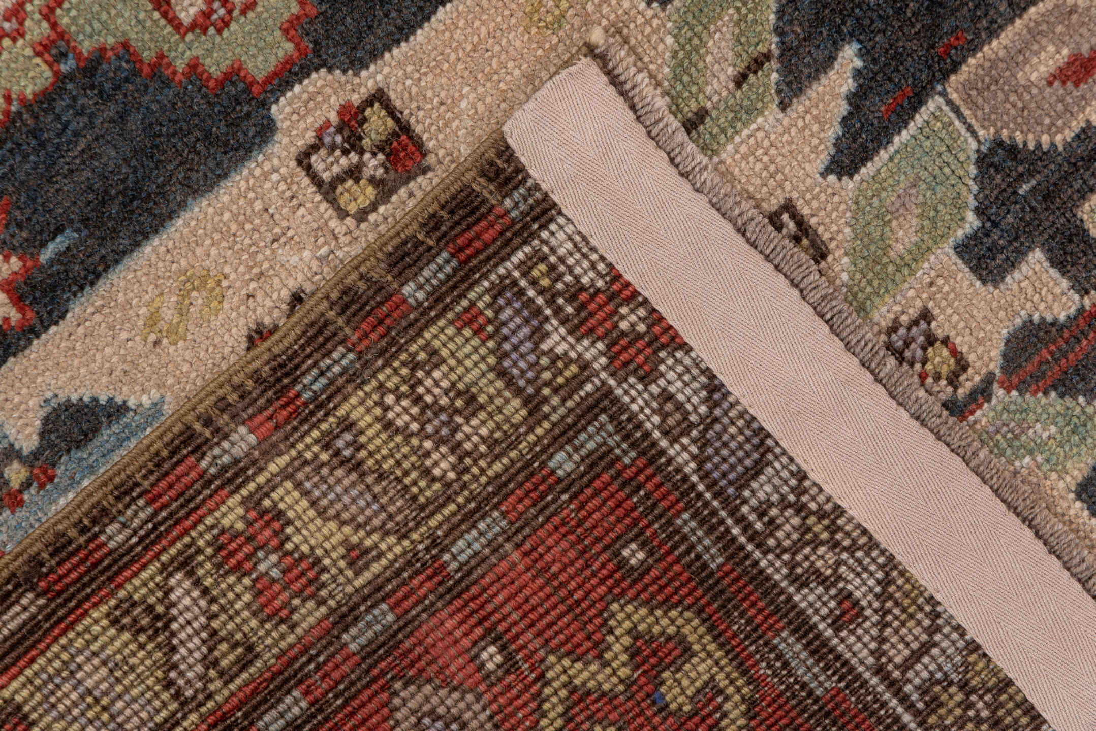 4' x 8' one-of-a-kind handmade vintage Caucasian rug. Color palette: black, brown, gray, light gray, off-white, pink