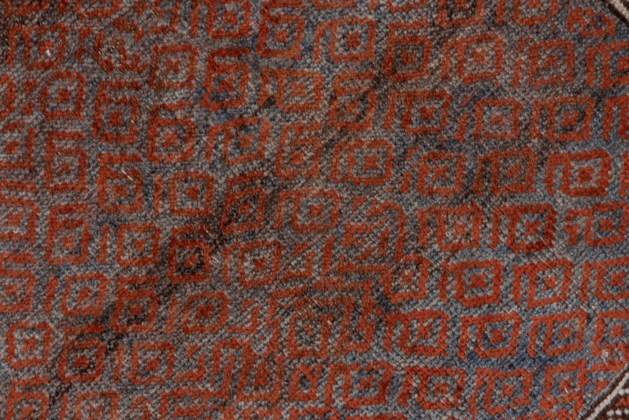 3' x 6' one-of-a-kind handmade antique Belouch small size rug. Color palette: rust, indigo, ivory, brown, charcoal