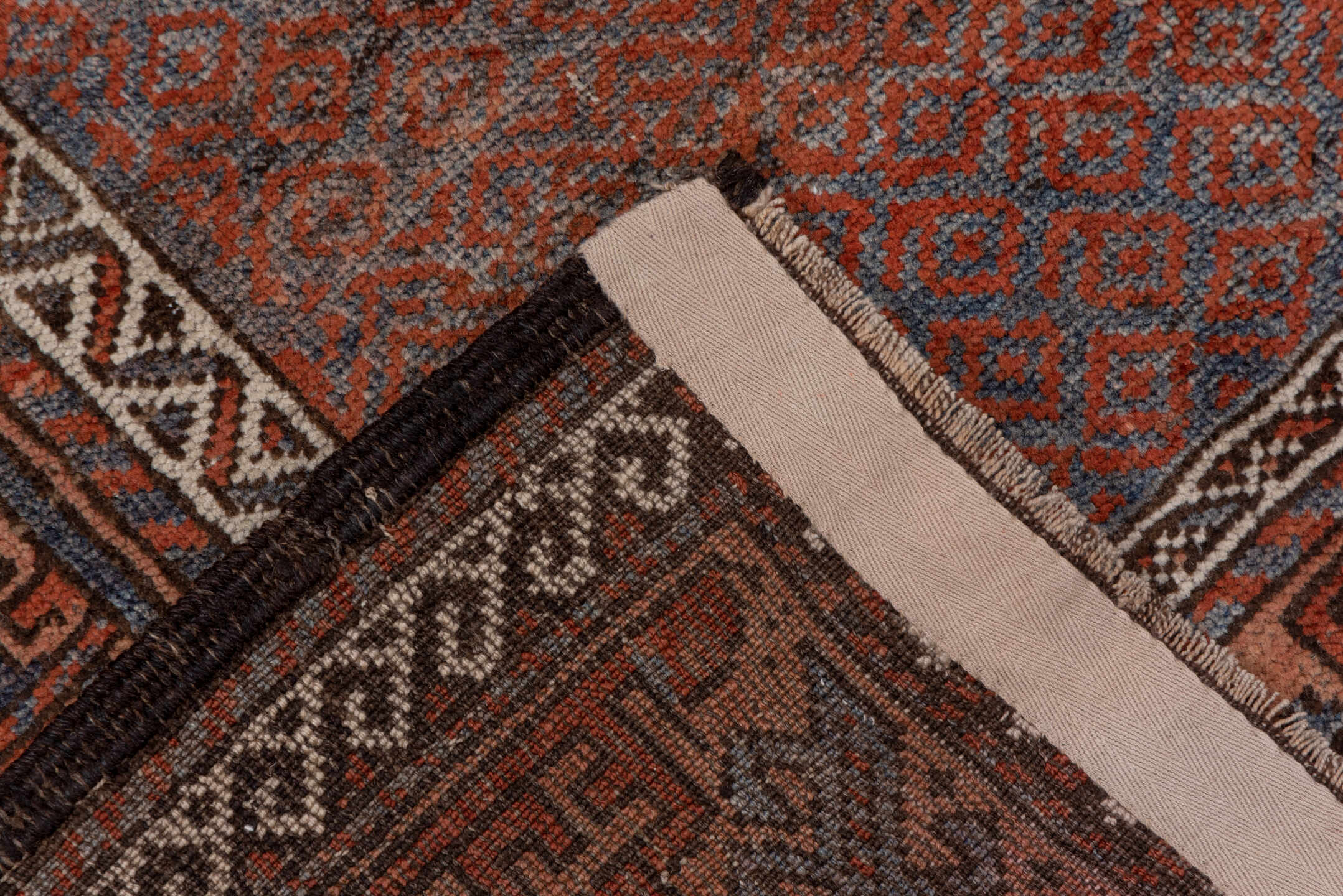 3' x 6' one-of-a-kind handmade antique Belouch small size rug. Color palette: rust, indigo, ivory, brown, charcoal