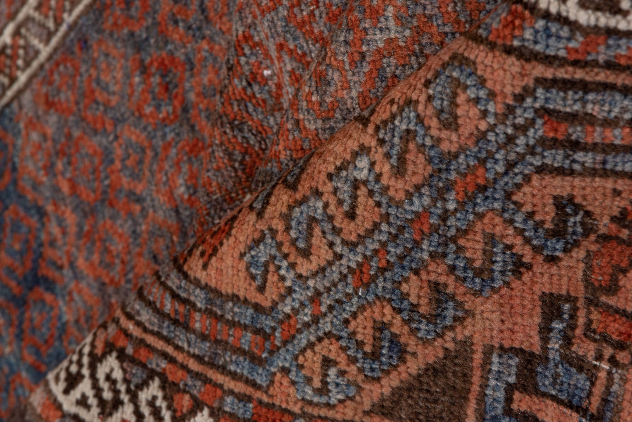 3' x 6' one-of-a-kind handmade antique Belouch small size rug. Color palette: rust, indigo, ivory, brown, charcoal