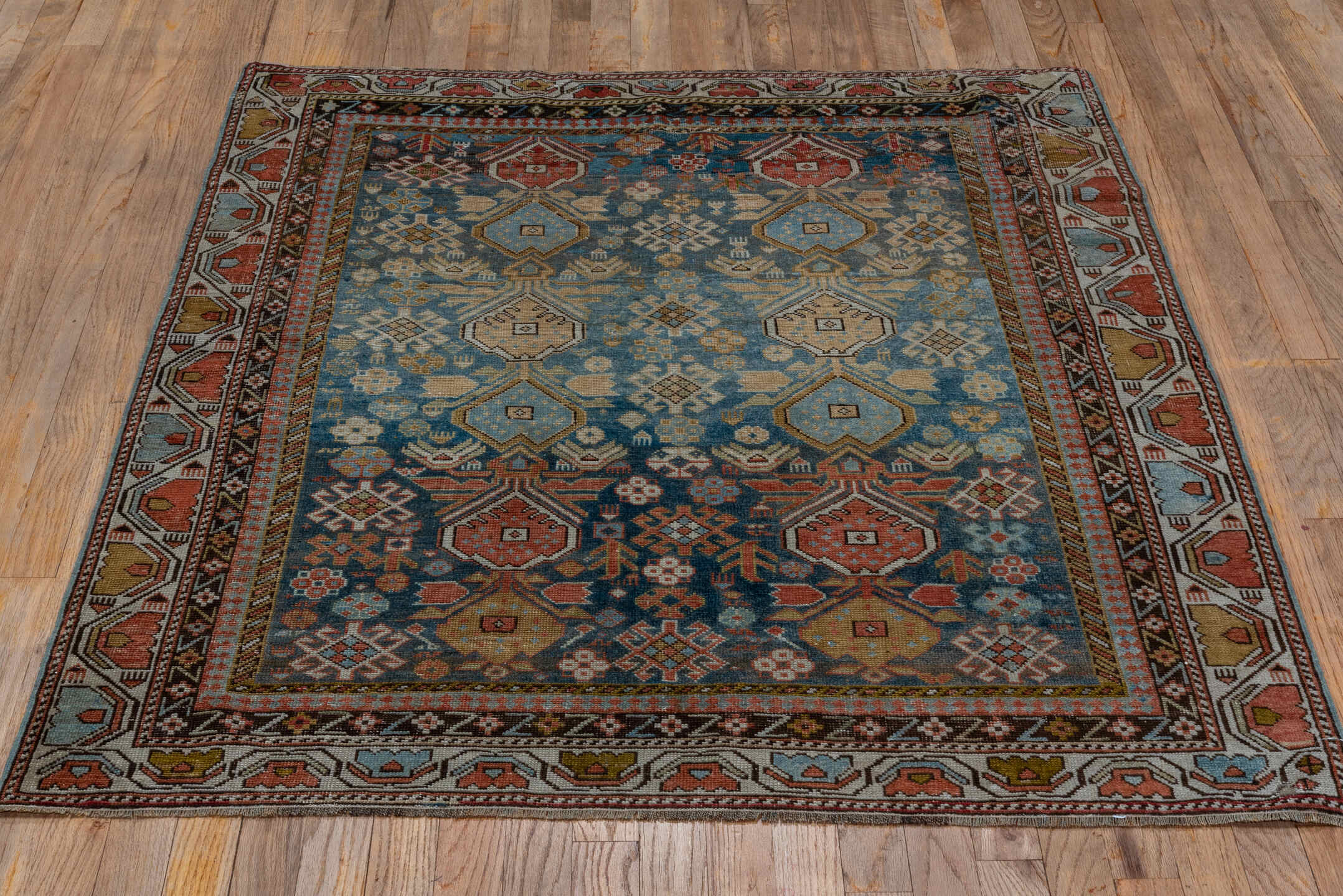 4' x 4' one-of-a-kind handmade antique Shirvan small size rug. Color palette: light blue, ivory, rust, brown, camel, navy