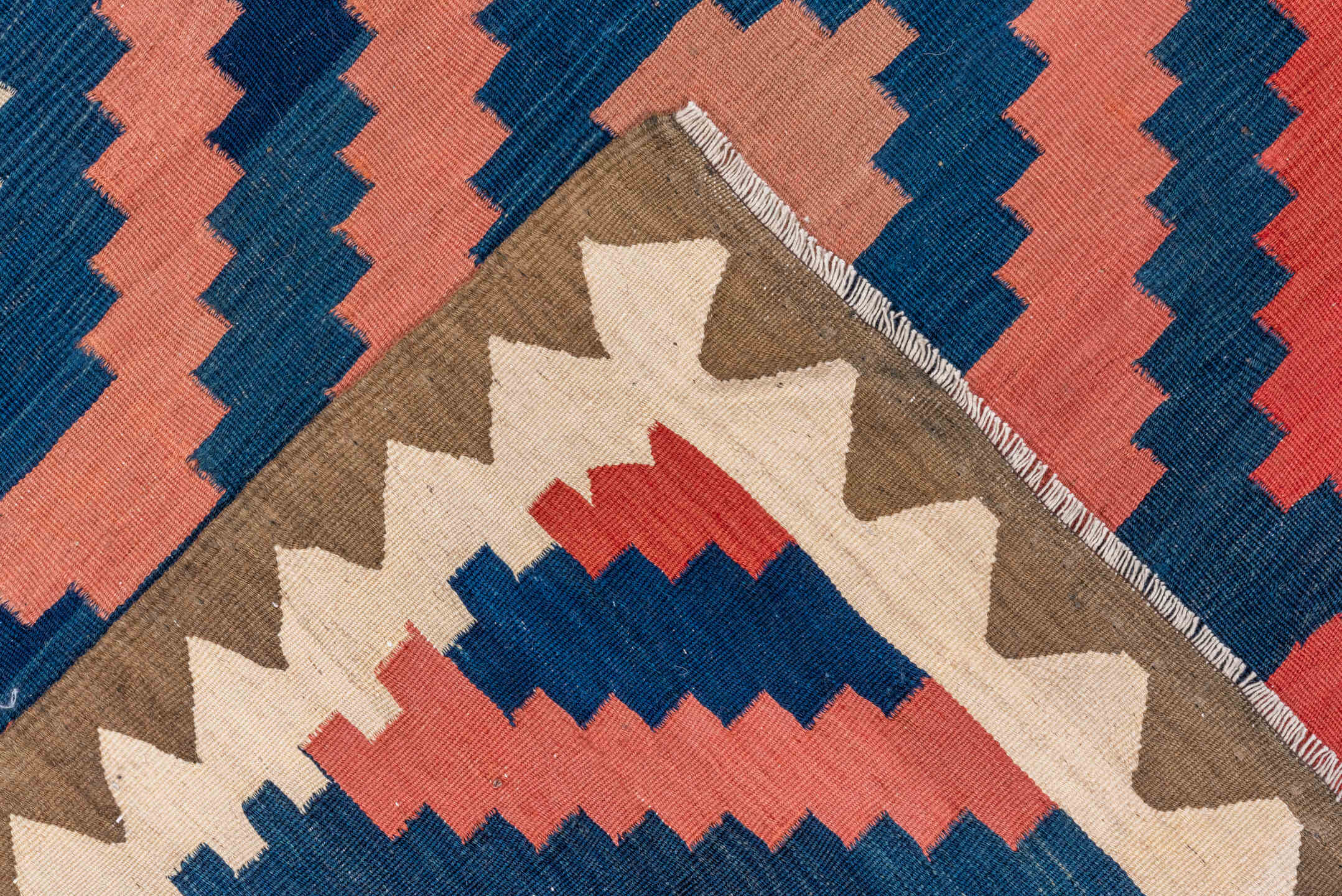 4' x 10' one-of-a-kind handmade vintage Kilim runner rug. Color palette: blue, brown, gray, off-white, orange, pink, red