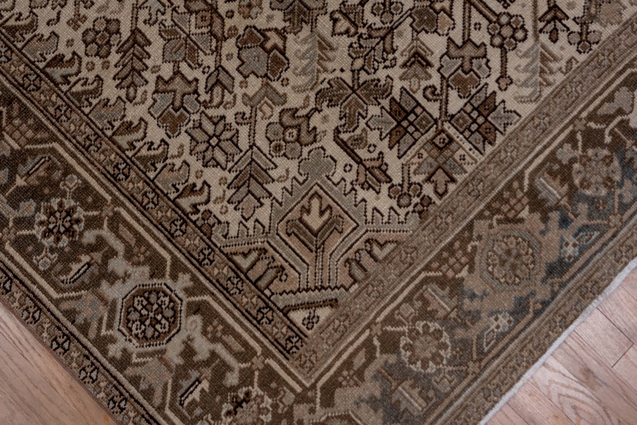 7' x 9' one-of-a-kind handmade vintage Heriz rug. Color palette: taupe, brown, ivory, charcoal, camel, greige, beige, gray
