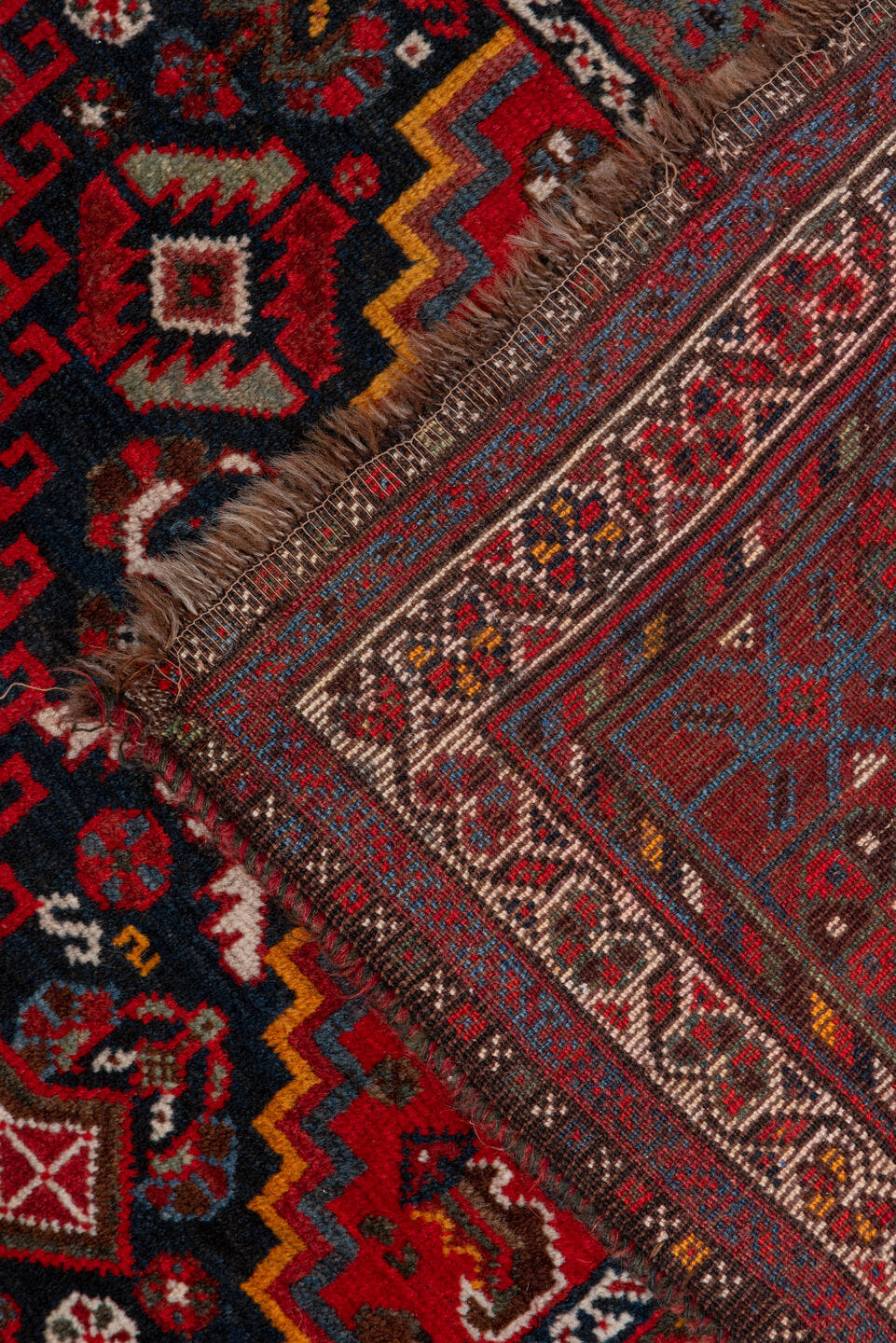 5' x 8' one-of-a-kind handmade antique Shiraz medium size rug. Color palette: red, navy, ivory, rust, burgundy, slate, gold