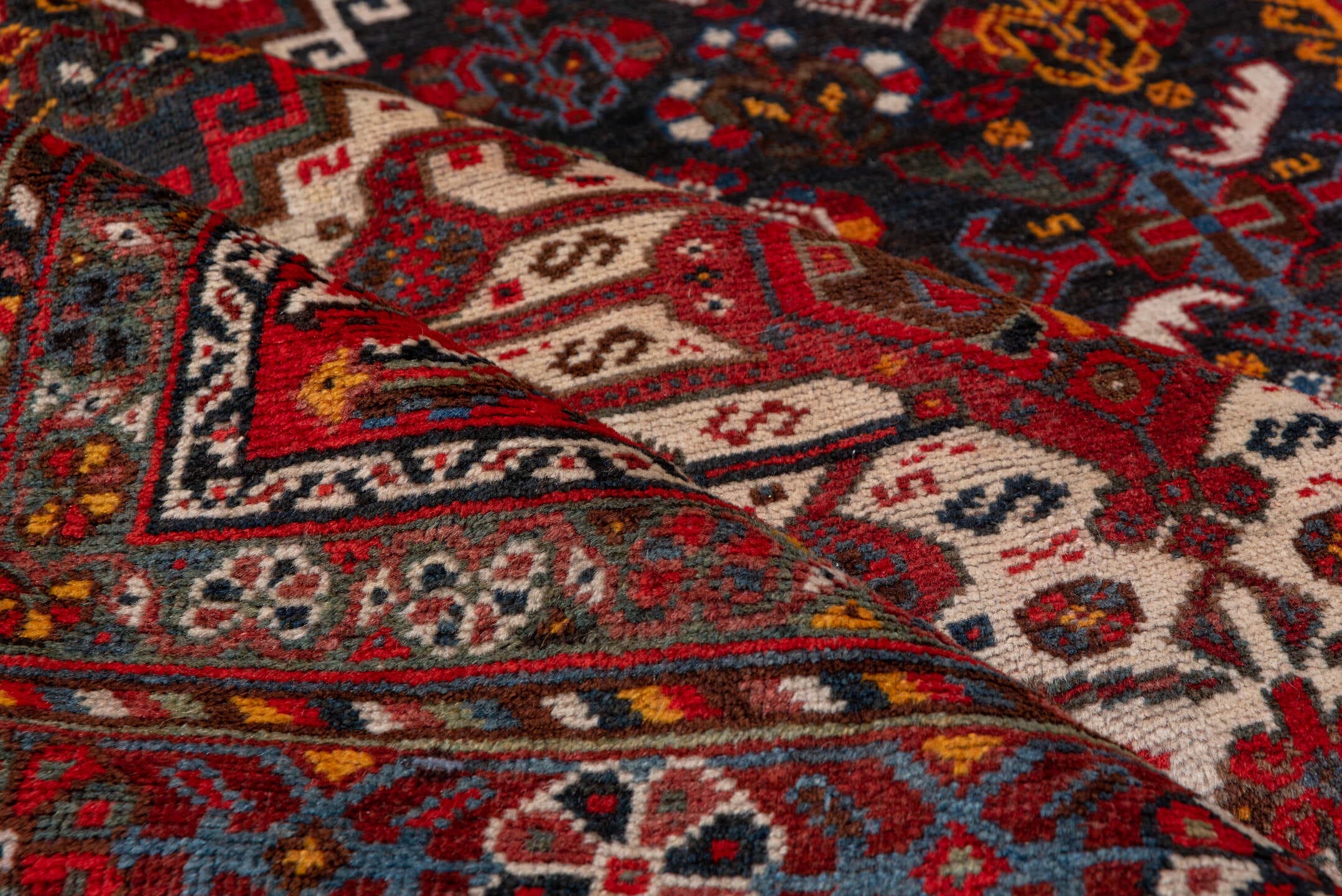 5' x 8' one-of-a-kind handmade antique Shiraz medium size rug. Color palette: red, navy, ivory, rust, burgundy, slate, gold