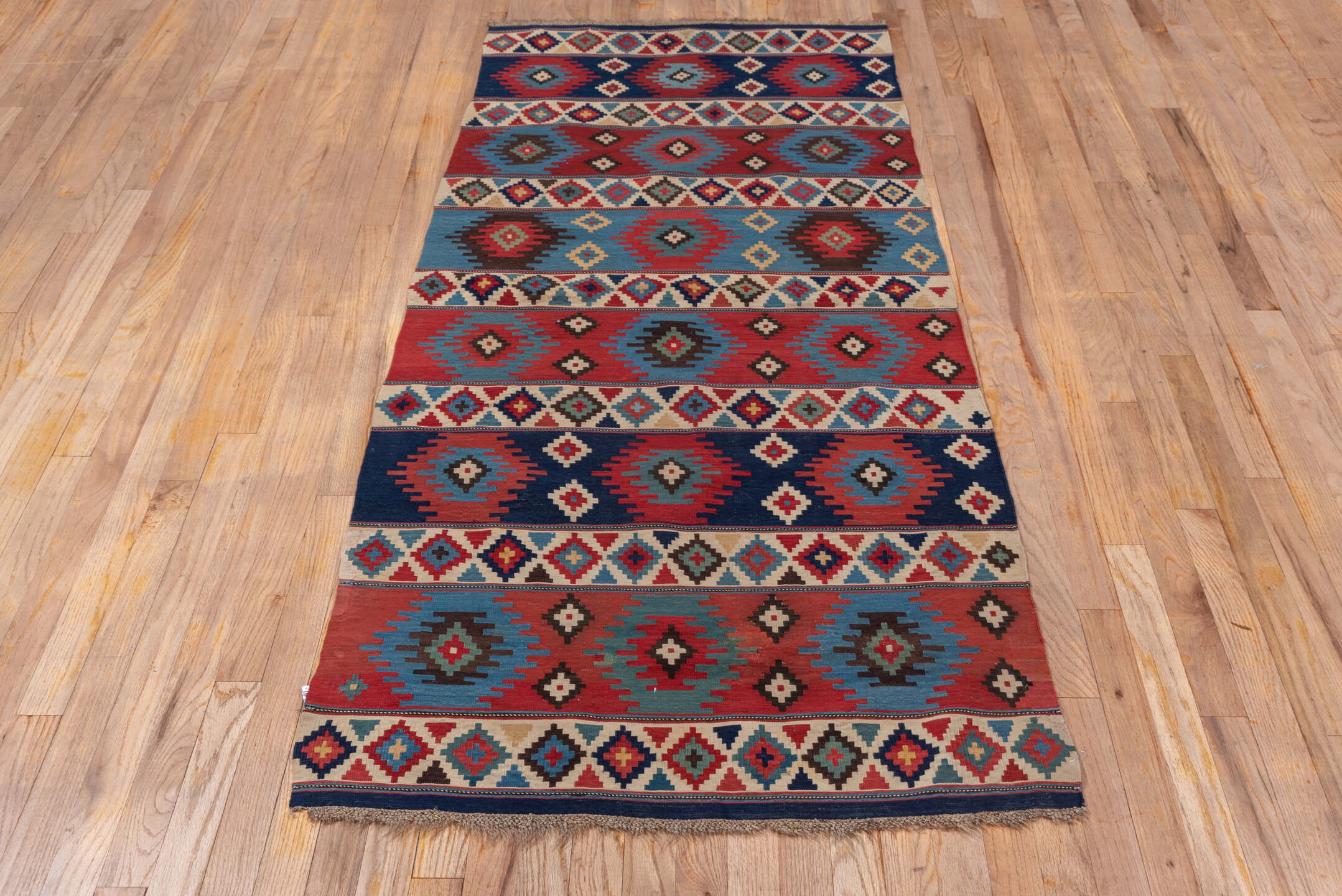 3' x 6' one-of-a-kind handmade vintage Shirvan runner rug. Color palette: arapawa, blue, brown, fiord, gray, pink, red