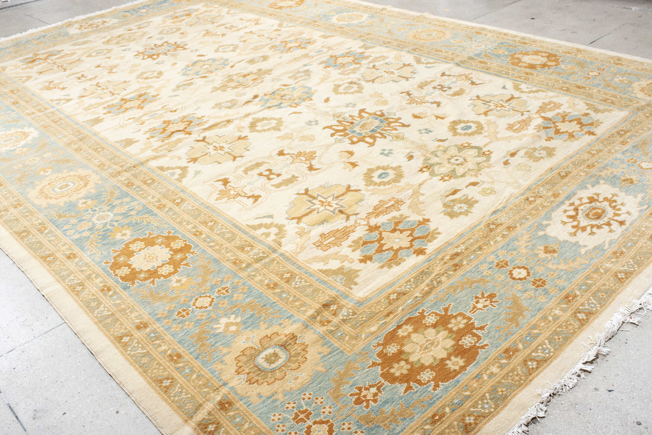 11' x 17' one-of-a-kind handmade vintage Sultanabad oversize rug. Color palette: ivory, sky blue, gold, camel, taupe, rust