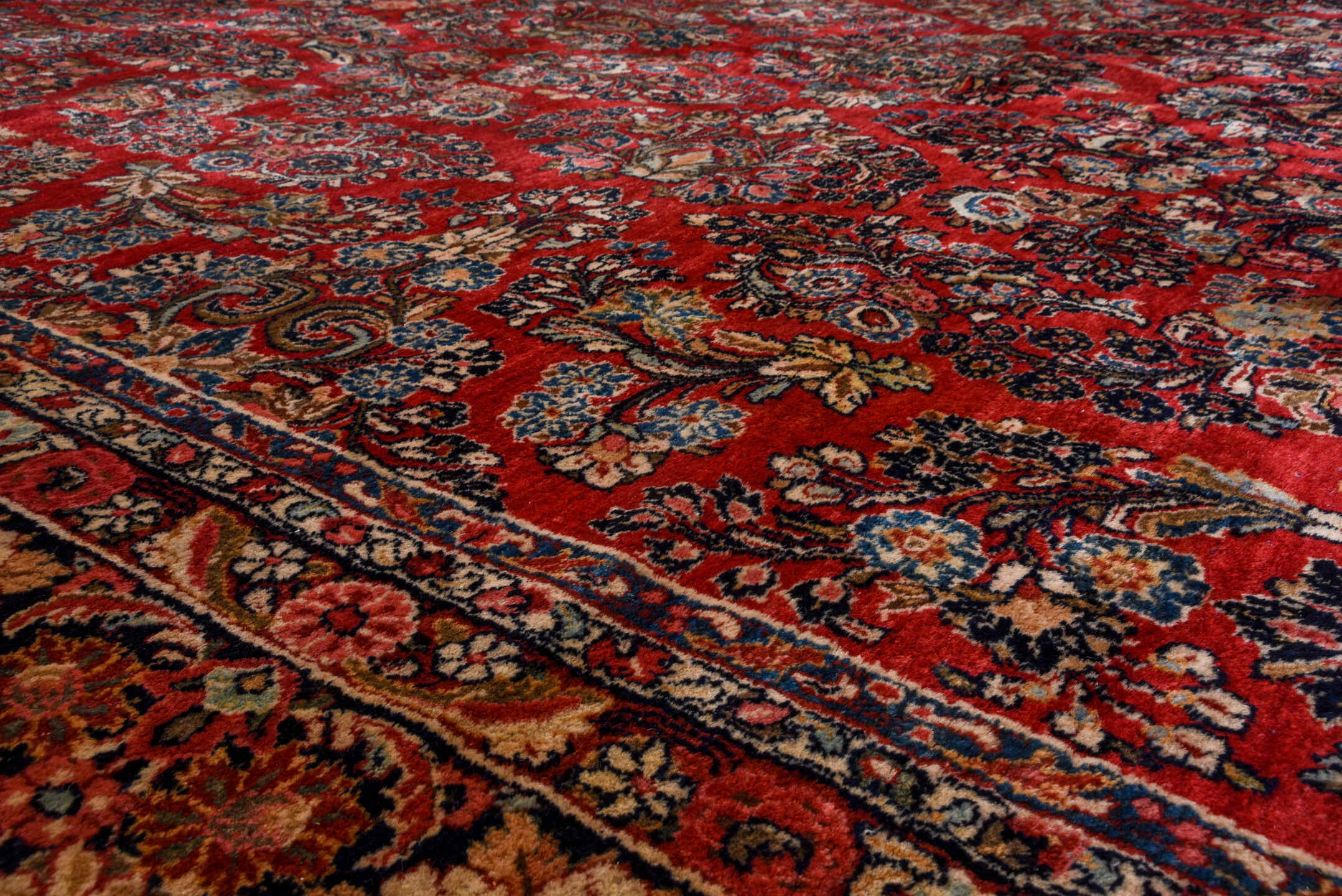 12' x 19' one-of-a-kind handmade vintage Sarouk oversize rug. Color palette: red, navy, ivory, rose, soft blue, burgundy