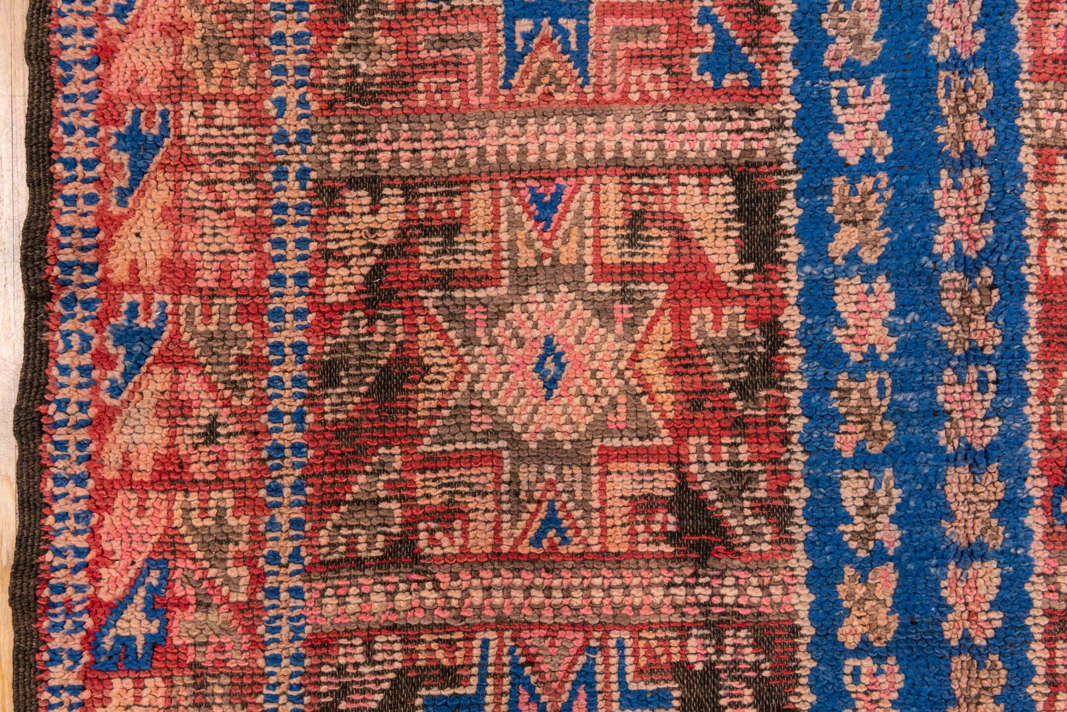 5' x 10' one-of-a-kind handmade vintage Moroccan medium size rug. Color palette: blue, brown, gray, pink, red, redwood