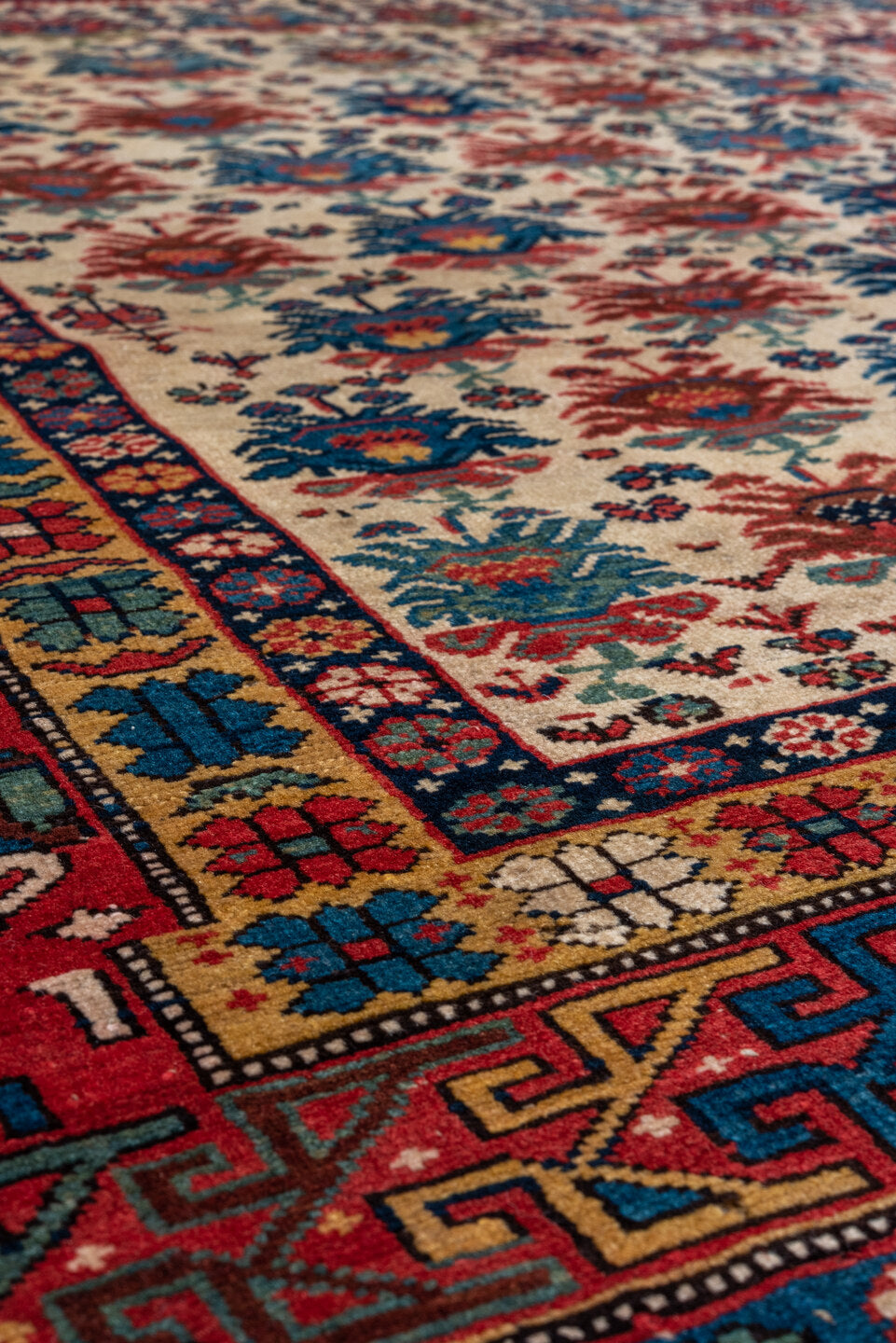 4' x 5' one-of-a-kind handmade vintage Shirvan small size rug. Color palette: arapawa, black, blue, brown, charcoal