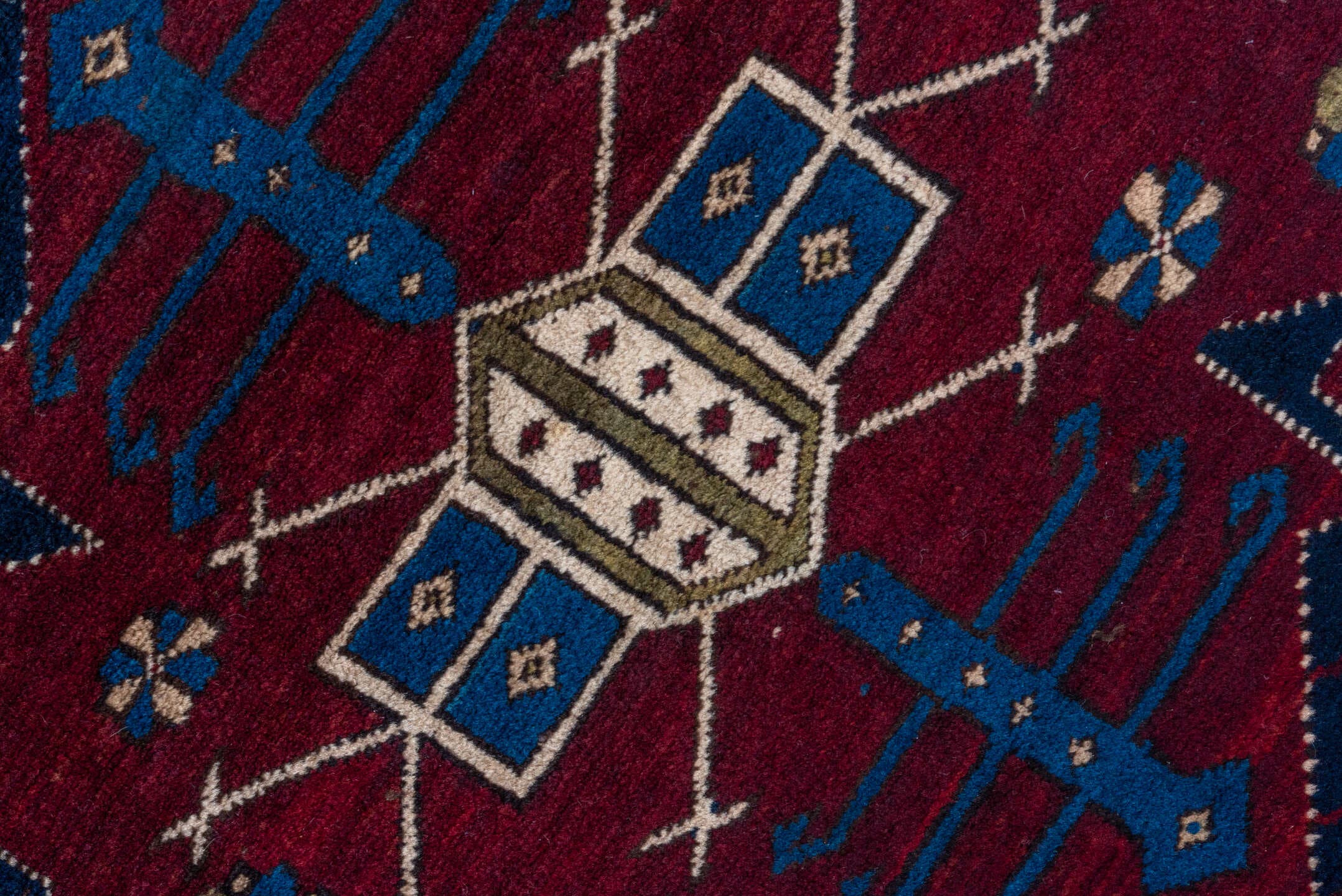 4' x 7' one-of-a-kind handmade antique Caucasian rug. Color palette: navy, crimson, ivory, cobalt, burgundy, camel, saffron