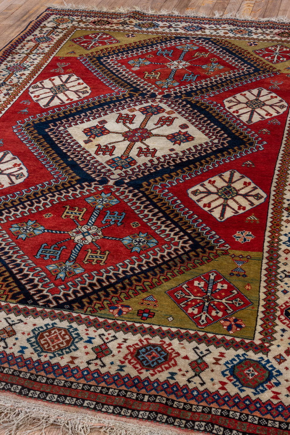 4' x 7' one-of-a-kind handmade vintage Qashqai rug. Color palette: crimson, ivory, indigo, camel, sky_blue, rust, black, red