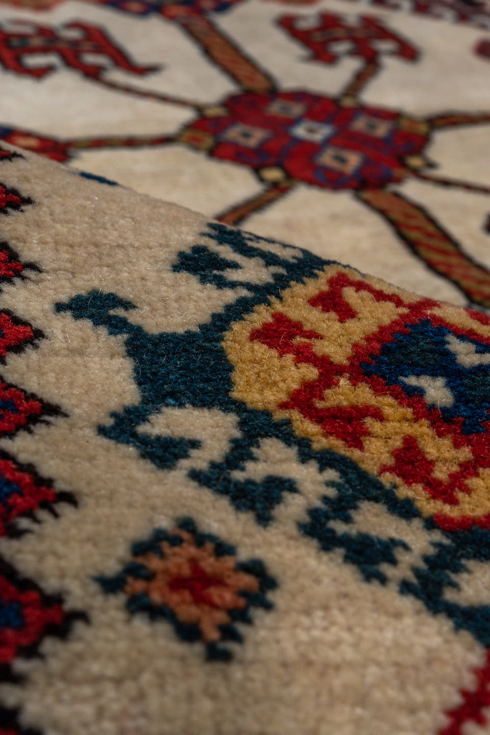 4' x 7' one-of-a-kind handmade vintage Qashqai rug. Color palette: crimson, ivory, indigo, camel, sky_blue, rust, black, red
