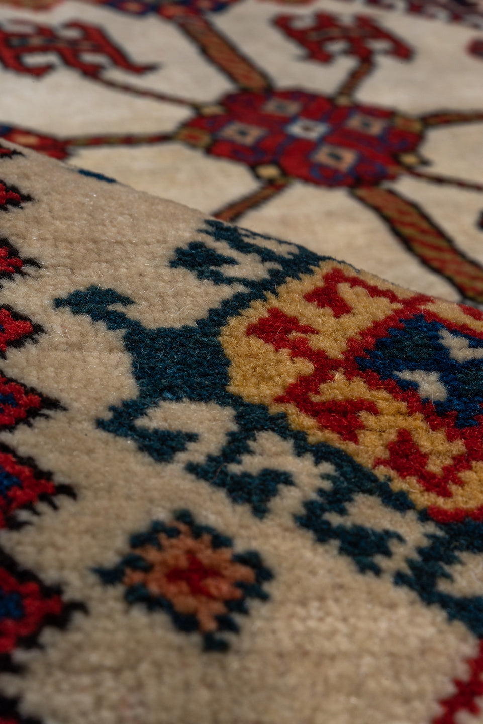 4' x 7' one-of-a-kind handmade vintage Qashqai rug. Color palette: crimson, ivory, indigo, camel, sky_blue, rust, black, red