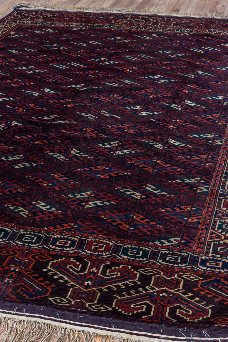 6' x 10' one-of-a-kind handmade vintage Yamoud large size rug. Color palette: burgundy, navy, rust, ivory, crimson, indigo