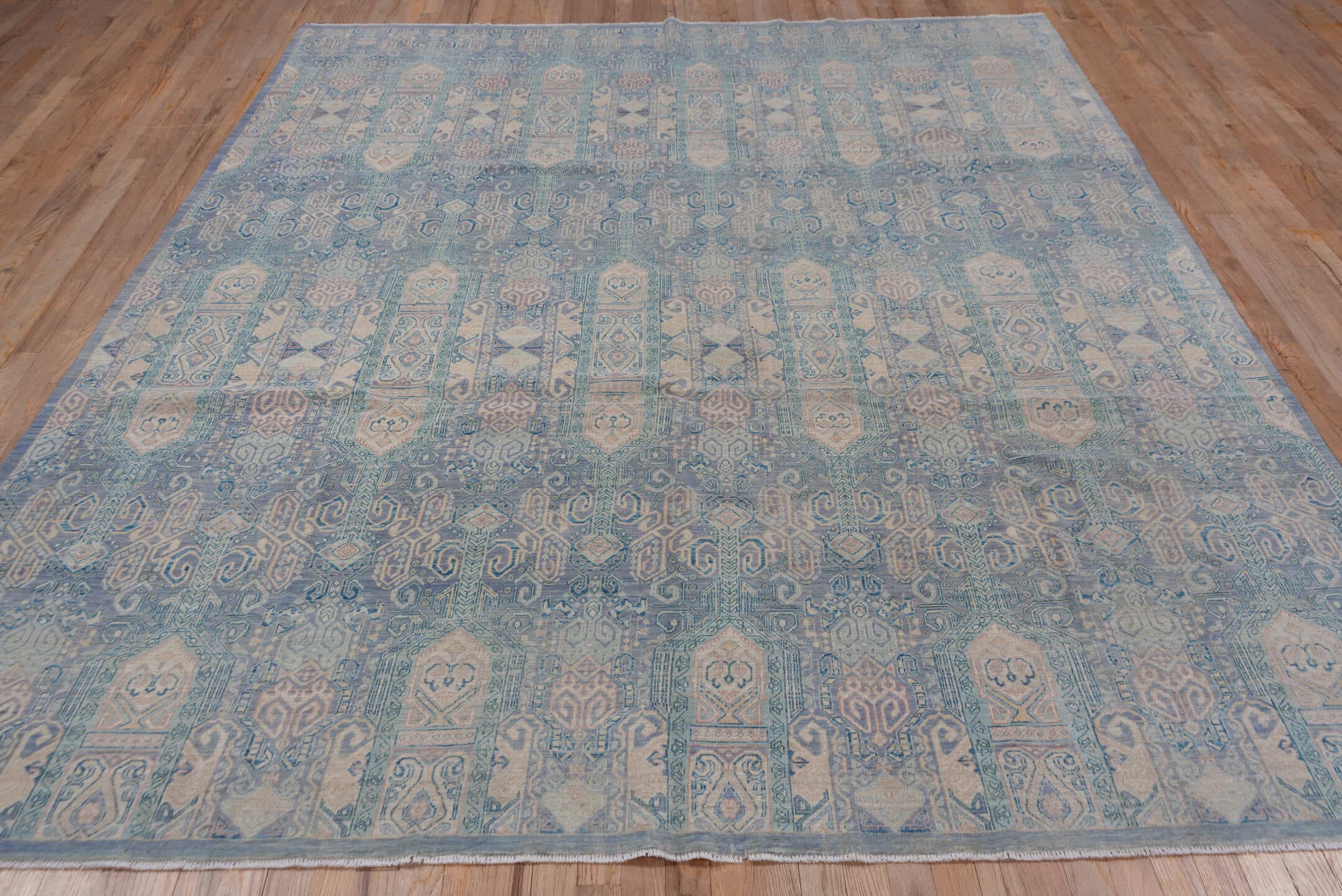 7' x 10' one-of-a-kind handmade vintage Afghan large size rug. Color palette: sky blue, ivory, pale blue, slate, taupe