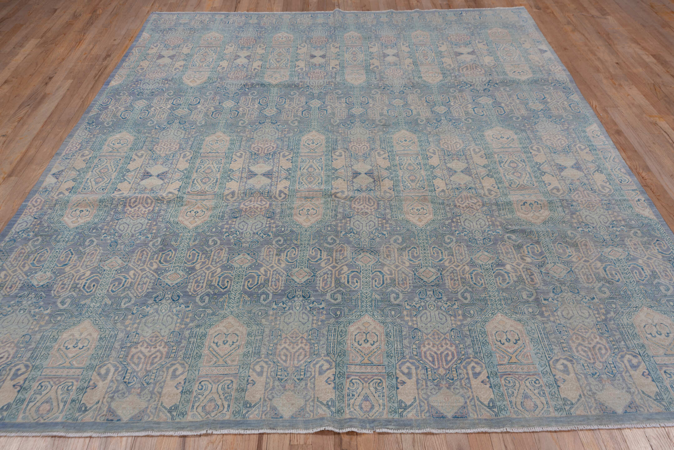 7' x 10' one-of-a-kind handmade vintage Afghan large size rug. Color palette: sky blue, ivory, pale blue, slate, taupe