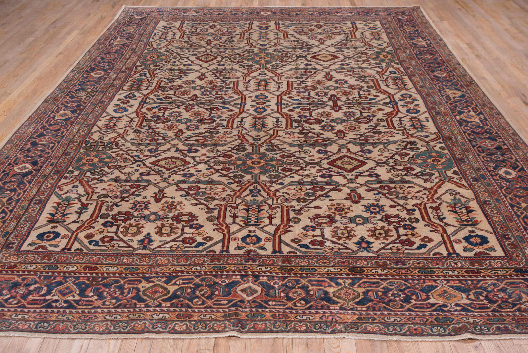 10' x 13' one-of-a-kind handmade antique Sultanabad large size rug. Color palette: ivory, navy, rust, soft blue, camel
