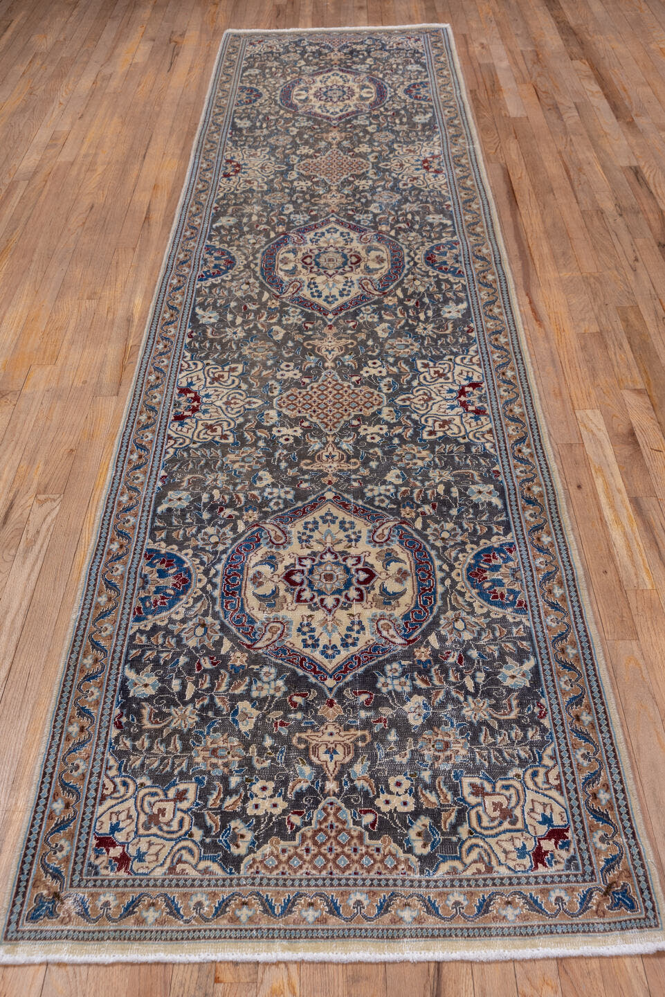 3' x 12' one-of-a-kind handmade vintage Naiin runner rug. Color palette: taupe, ivory, blue, camel, slate, navy, rust, beige