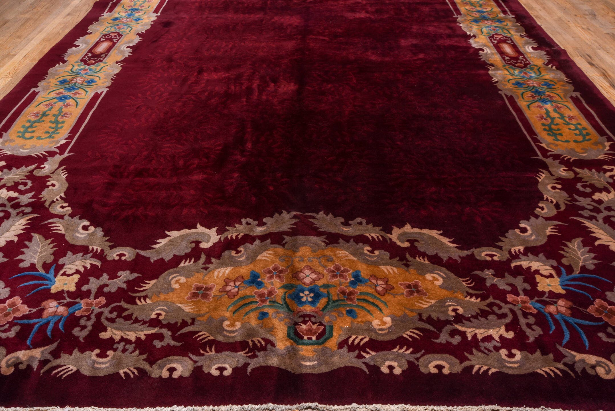 10' x 17' one-of-a-kind handmade antique Chinese rug. Color palette: burgundy, gold, ivory, blue, rose, taupe, pink, red