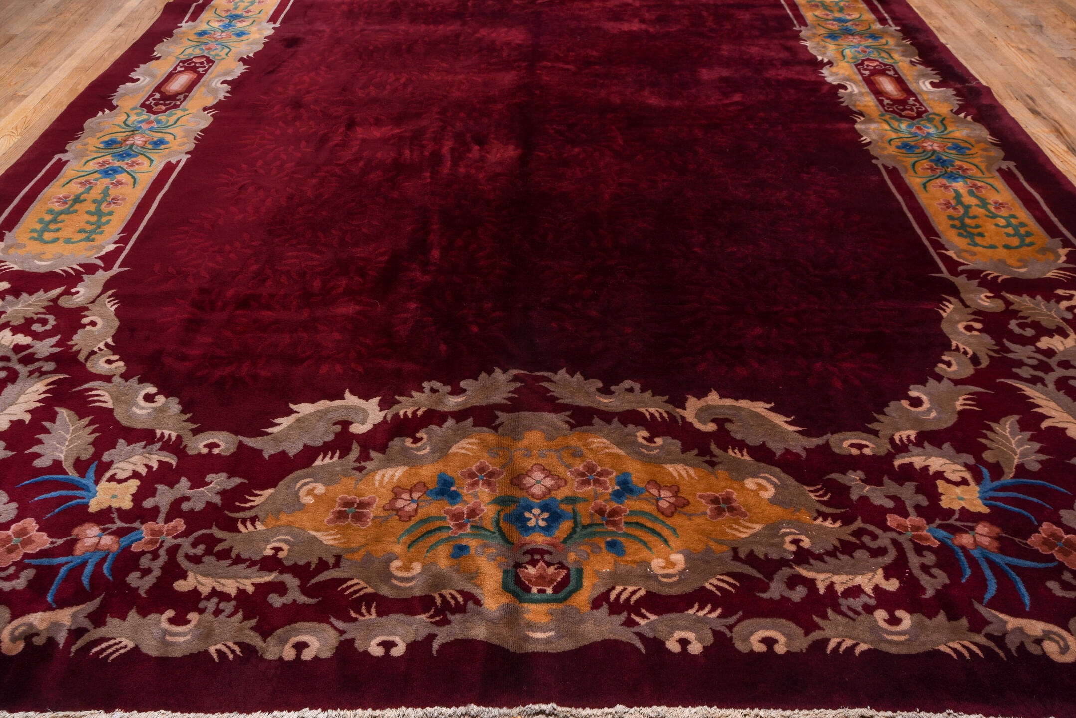 10' x 17' one-of-a-kind handmade antique Chinese rug. Color palette: burgundy, gold, ivory, blue, rose, taupe, pink, red