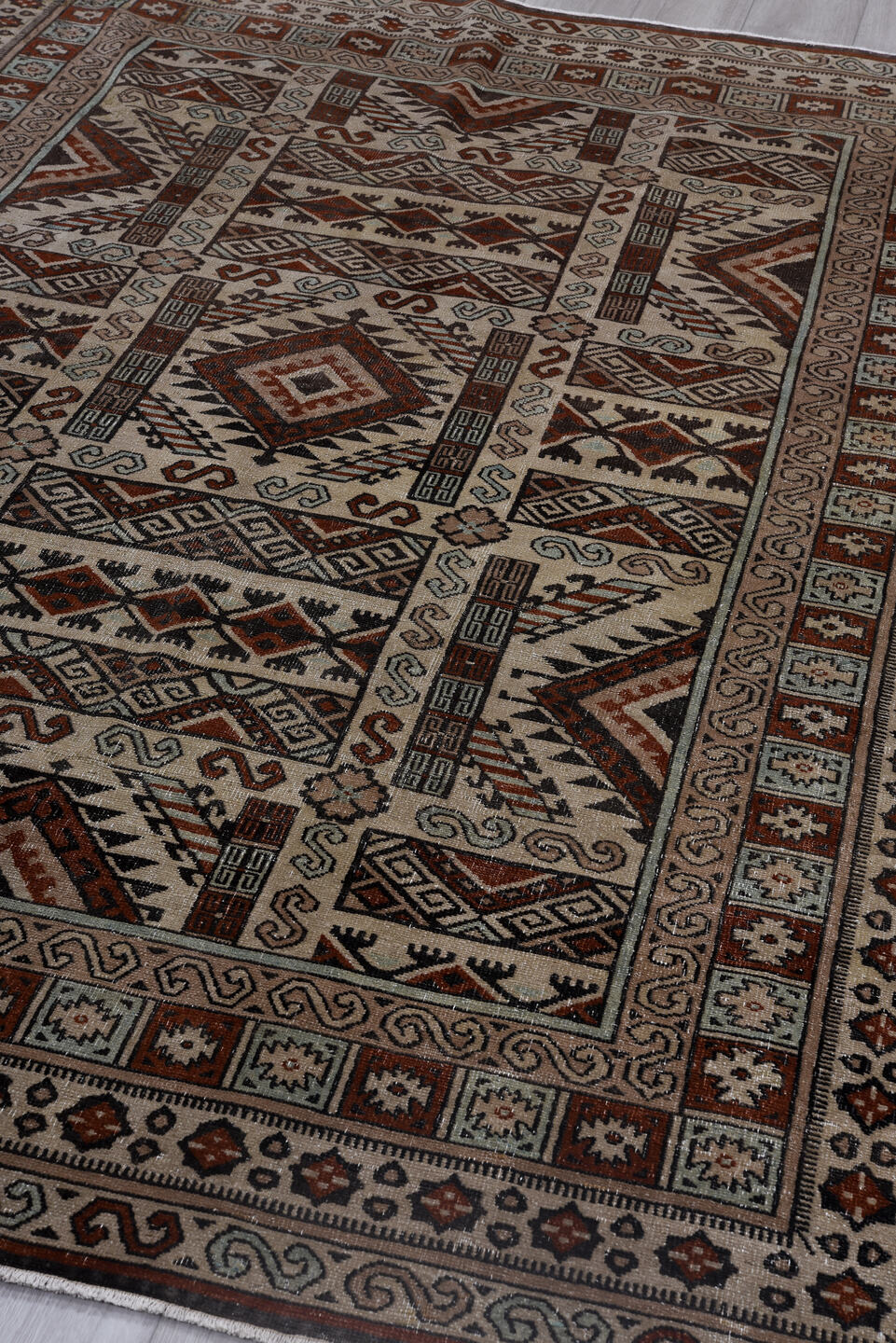 6' x 8' one-of-a-kind handmade antique Khotan medium size rug. Color palette: ivory, rust, brown, pale_blue, charcoal, taupe