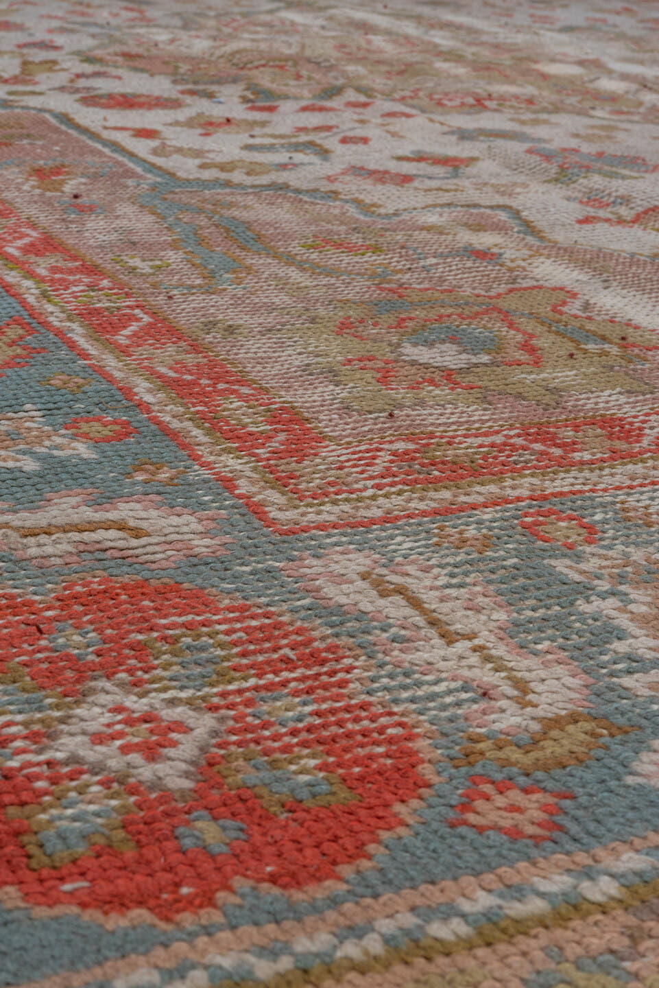 7' x 9' one-of-a-kind handmade antique Oushak rug. Color palette: ivory, powder_blue, coral, taupe, muted_gold, sage