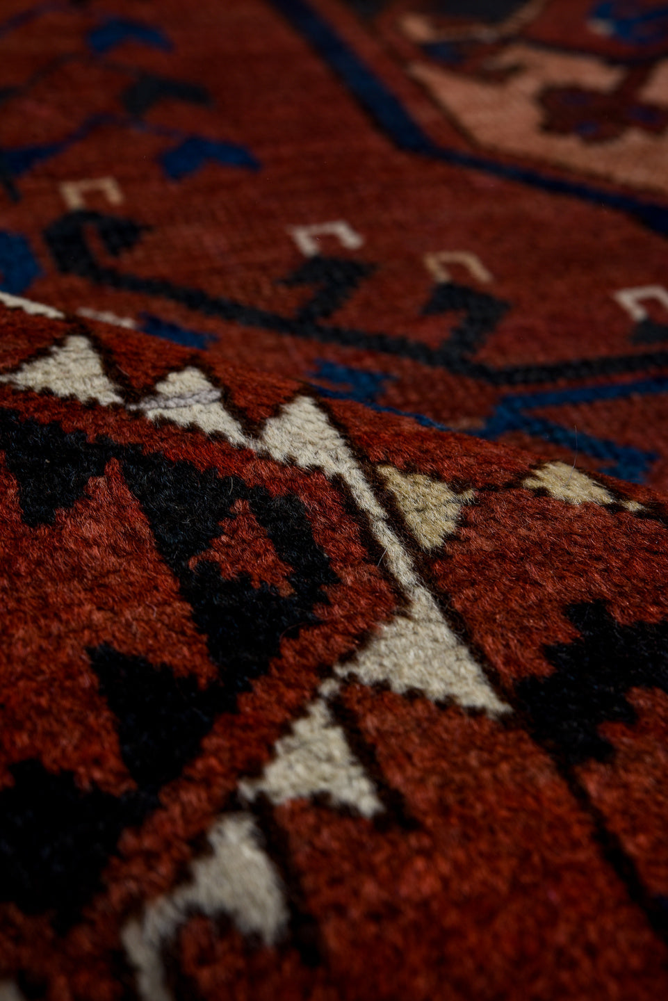 6' x 7' one-of-a-kind handmade vintage Afghan rug. Color palette: black, brown, gray, light gray, off-white, pink, red