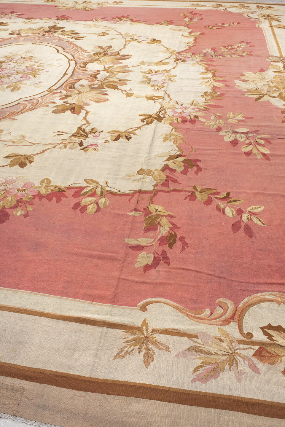 18' x 18' one-of-a-kind handmade antique Aubusson oversize rug. Color palette: rose, ivory, taupe, camel, blush, burgundy