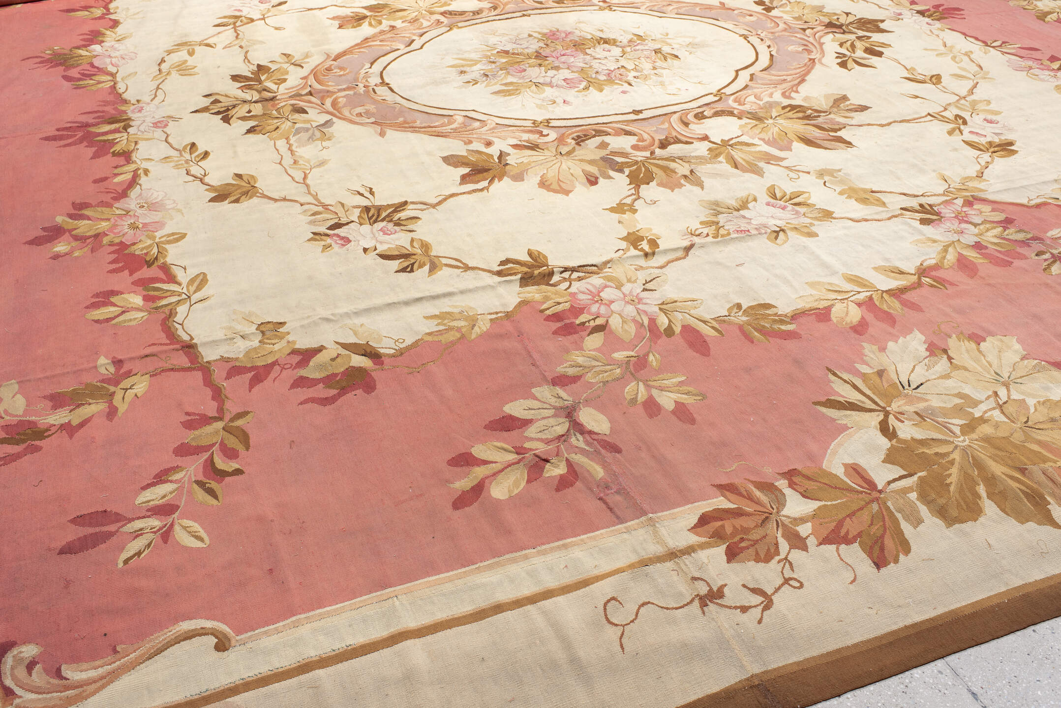 18' x 18' one-of-a-kind handmade antique Aubusson oversize rug. Color palette: rose, ivory, taupe, camel, blush, burgundy