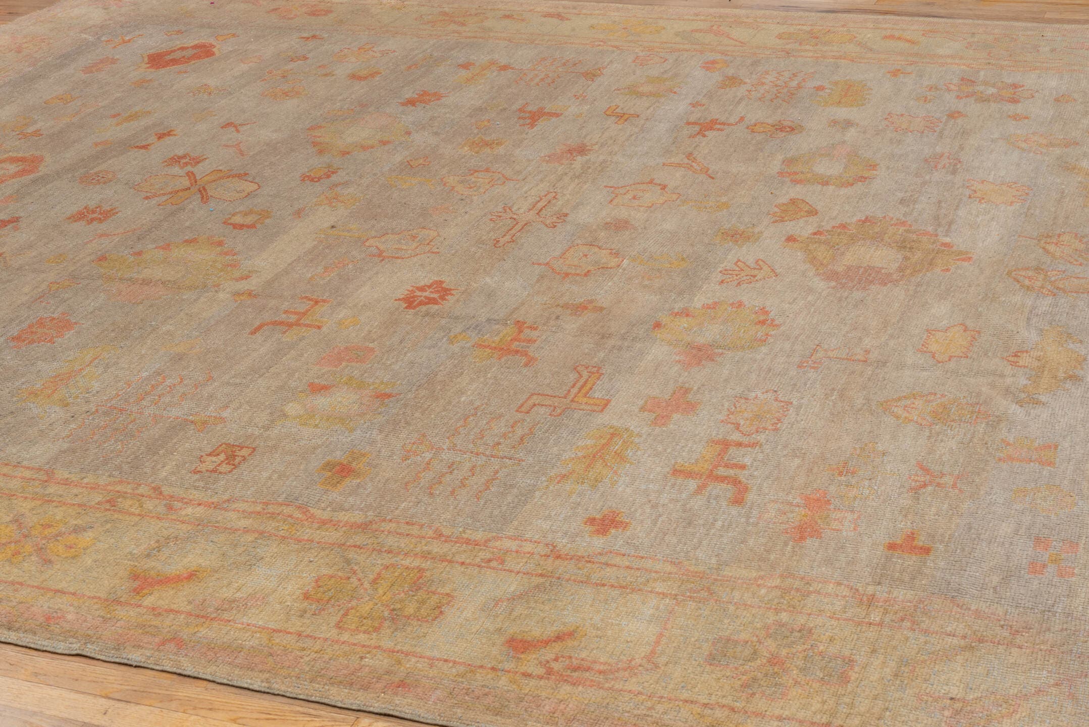 11' x 14' one-of-a-kind handmade vintage Oushak oversize rug. Color palette: beige, taupe, peach, coral, ivory, gold, sand