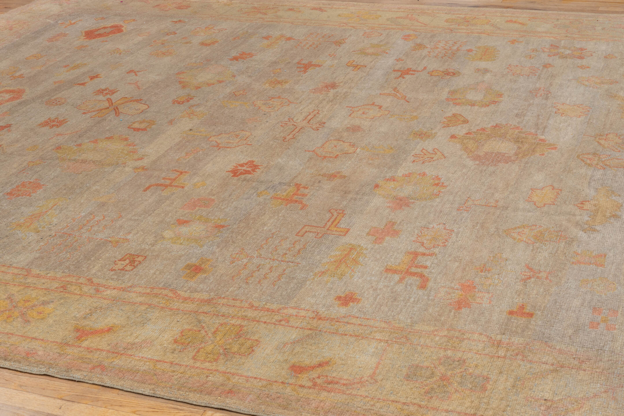 11' x 14' one-of-a-kind handmade vintage Oushak oversize rug. Color palette: beige, taupe, peach, coral, ivory, gold, sand