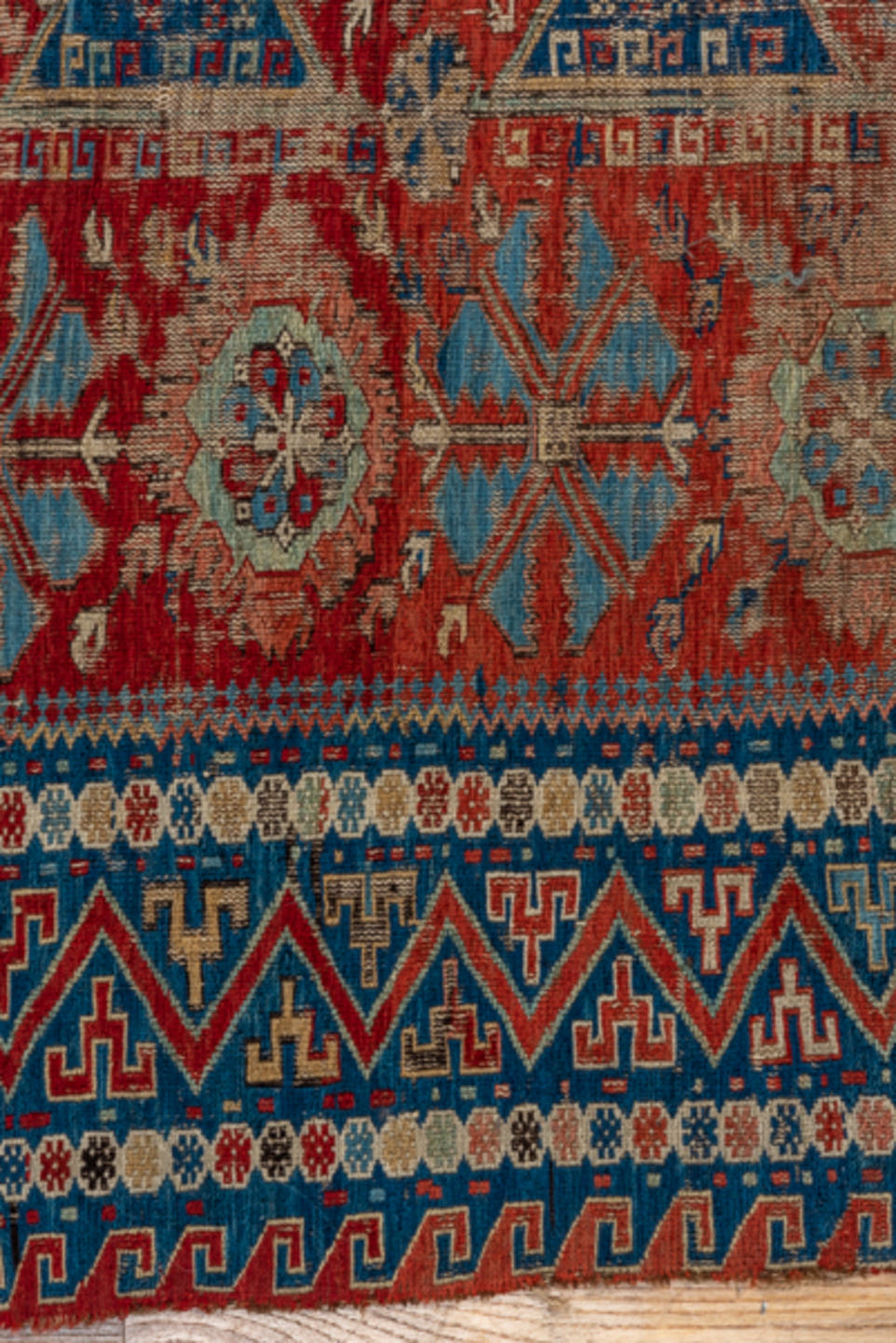 8' x 9' one-of-a-kind handmade antique Sumak rug. Color palette: rust, navy, ivory, sky blue, camel, crimson, terracotta