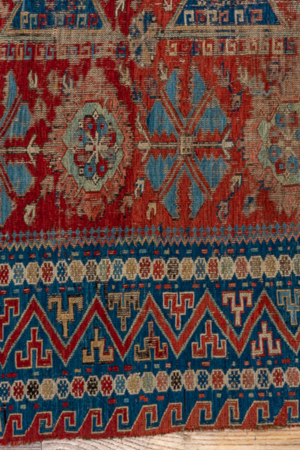 8' x 9' one-of-a-kind handmade antique Sumak rug. Color palette: rust, navy, ivory, sky blue, camel, crimson, terracotta