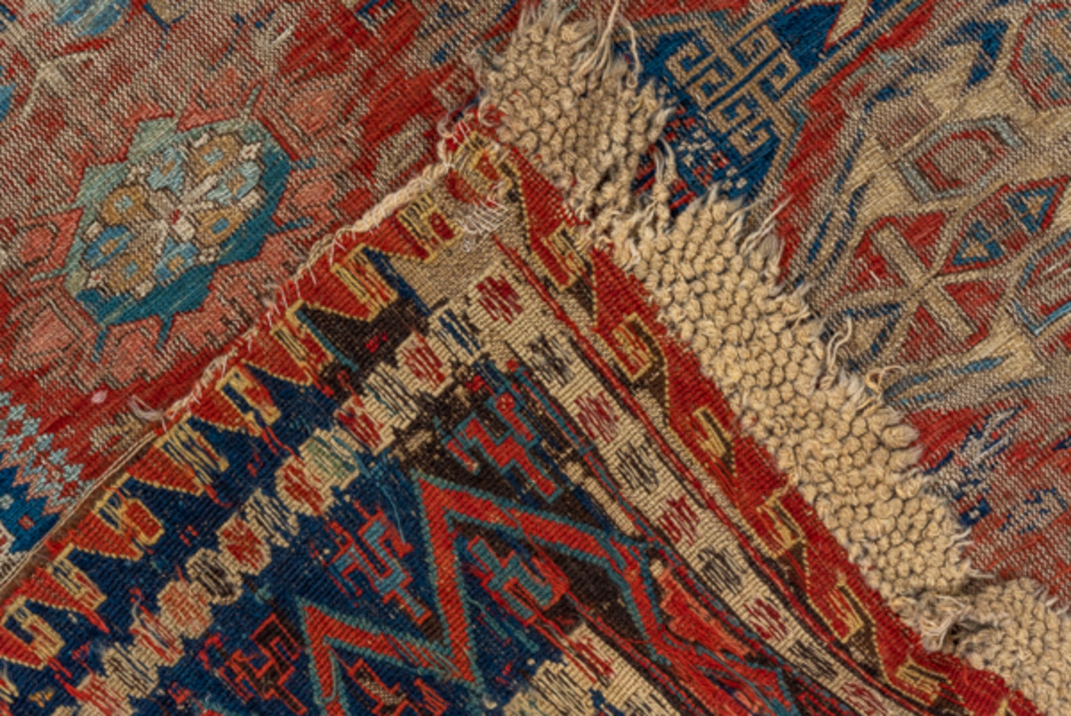 8' x 9' one-of-a-kind handmade antique Sumak rug. Color palette: rust, navy, ivory, sky blue, camel, crimson, terracotta