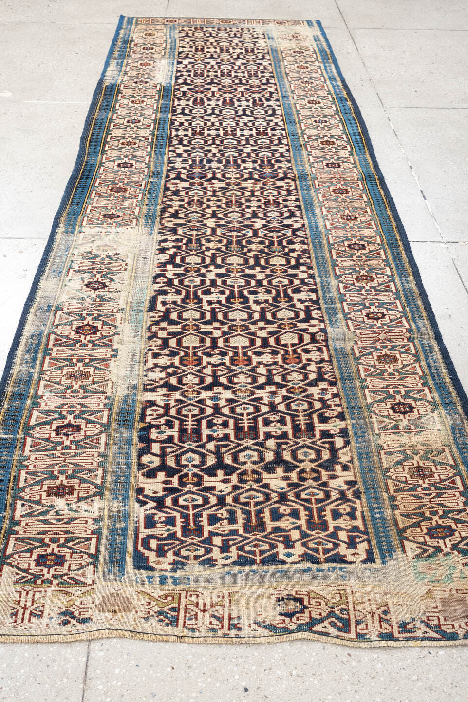 3' x 10' one-of-a-kind handmade antique Kuba runner rug. Color palette: indigo, ivory, rust, sky blue, camel, slate, purple