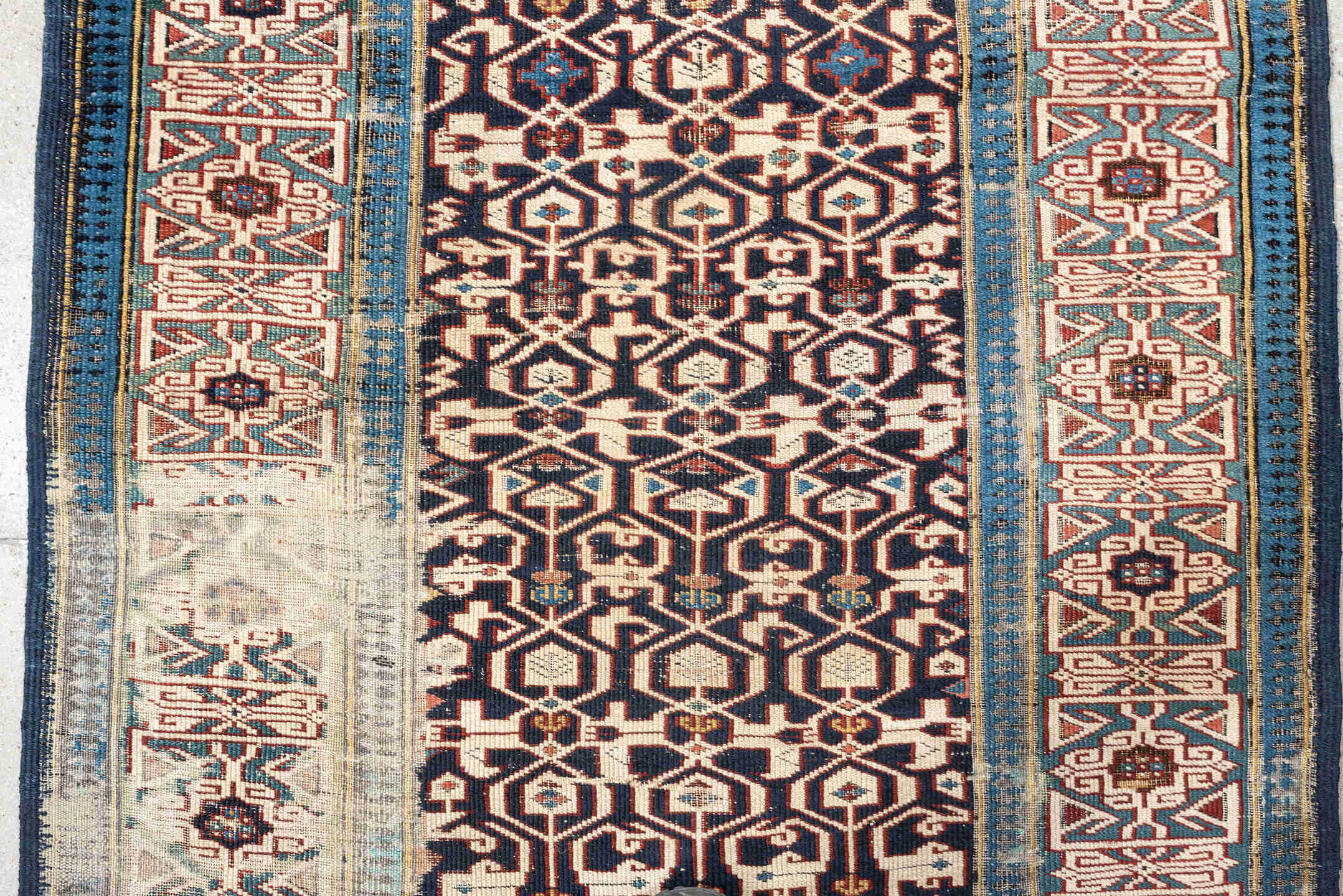 3' x 10' one-of-a-kind handmade antique Kuba runner rug. Color palette: indigo, ivory, rust, sky blue, camel, slate, purple