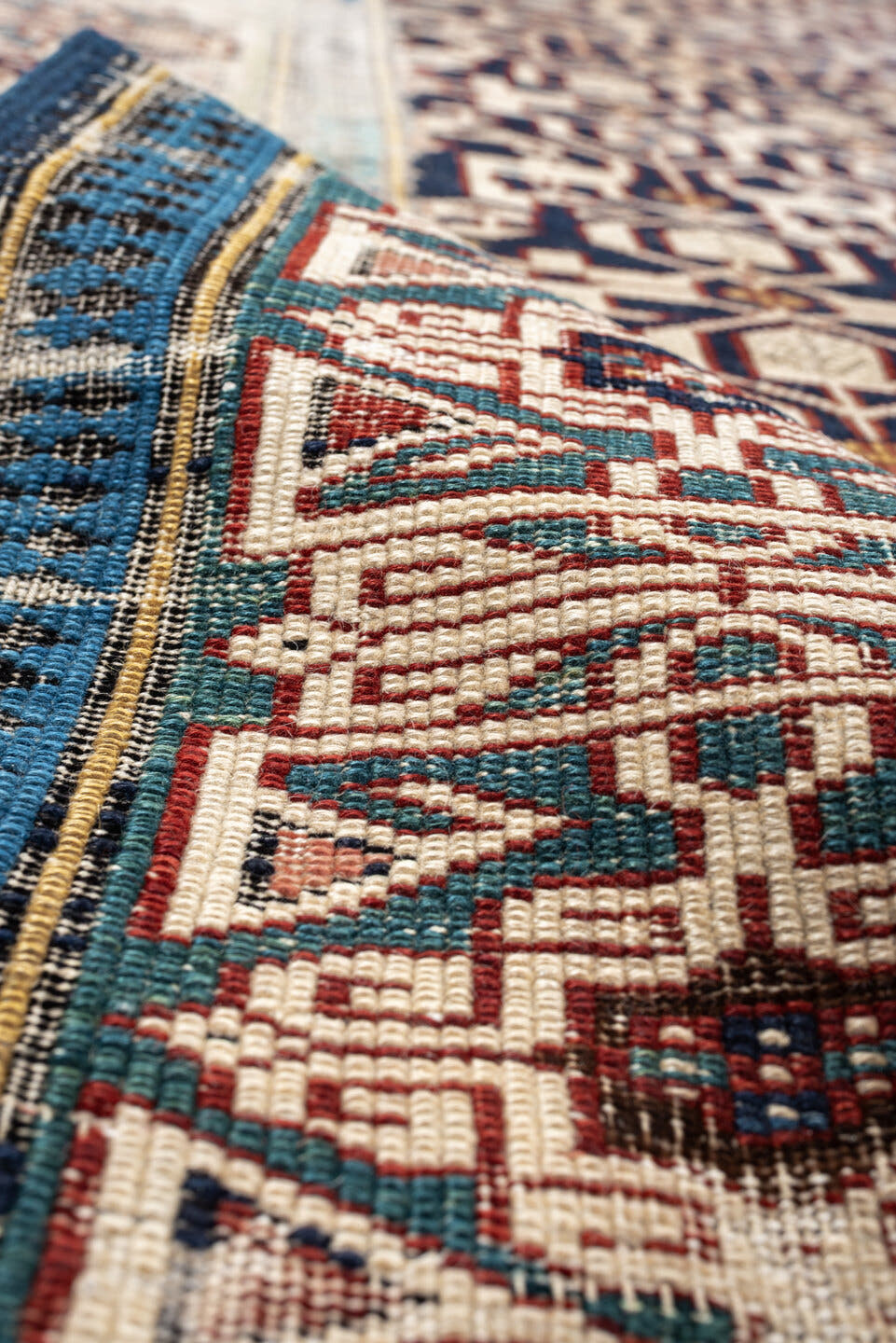 3' x 10' one-of-a-kind handmade antique Kuba runner rug. Color palette: indigo, ivory, rust, sky blue, camel, slate, purple