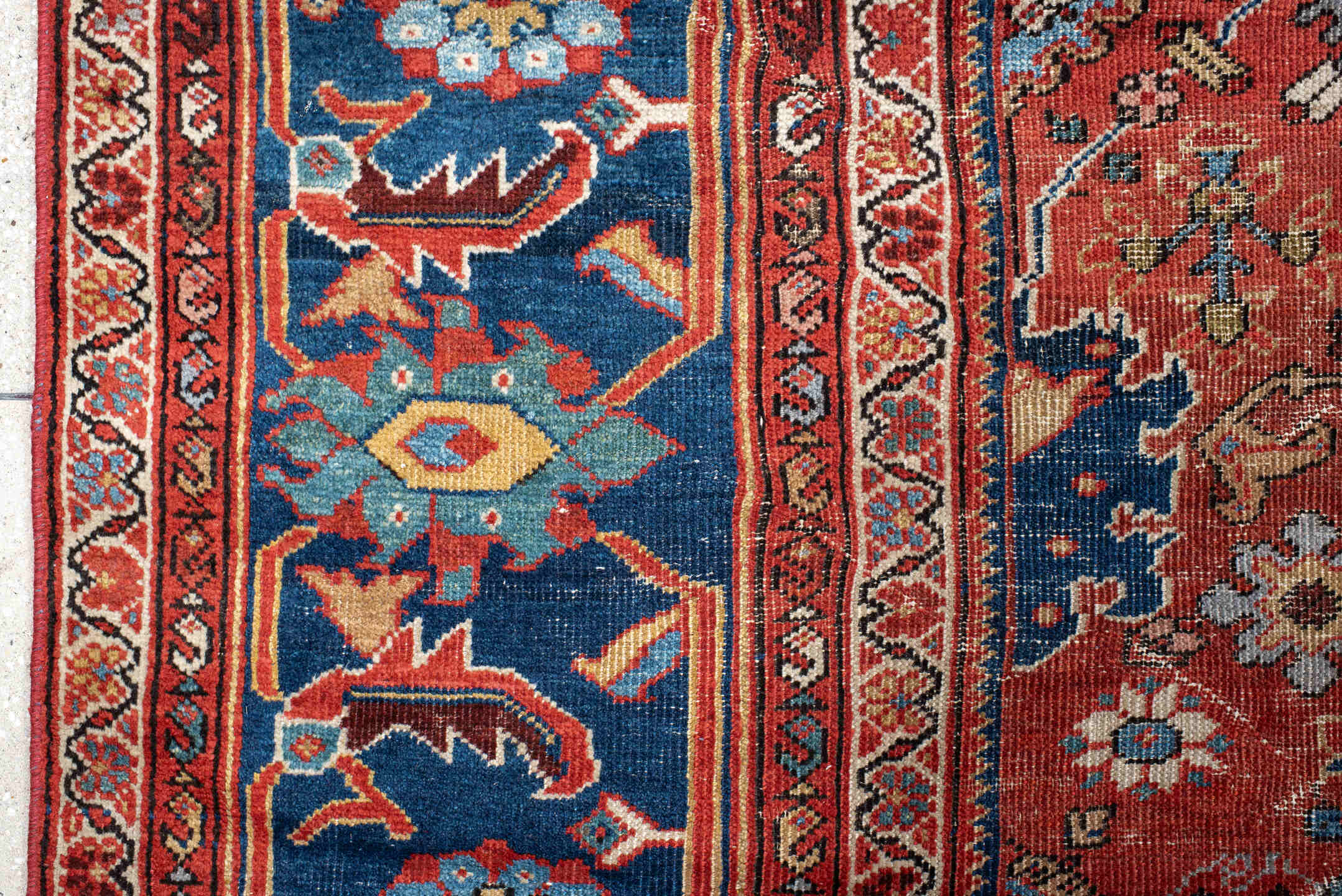 12' x 17' one-of-a-kind handmade vintage Sultanabad oversize rug. Color palette: rust, navy, ivory, sky blue, terracotta