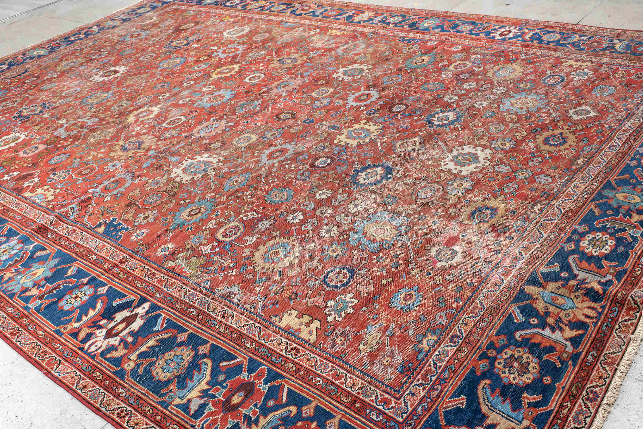 12' x 17' one-of-a-kind handmade vintage Sultanabad oversize rug. Color palette: rust, navy, ivory, sky blue, terracotta