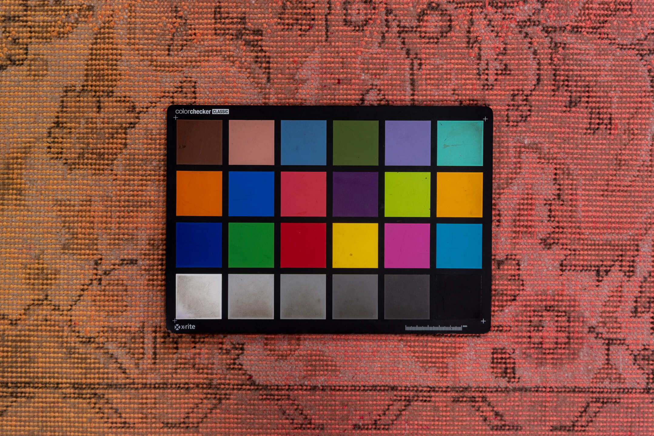 5' x 9' one-of-a-kind handmade vintage Sparta medium size rug. Color palette: brown, off-white, orange, pink, red