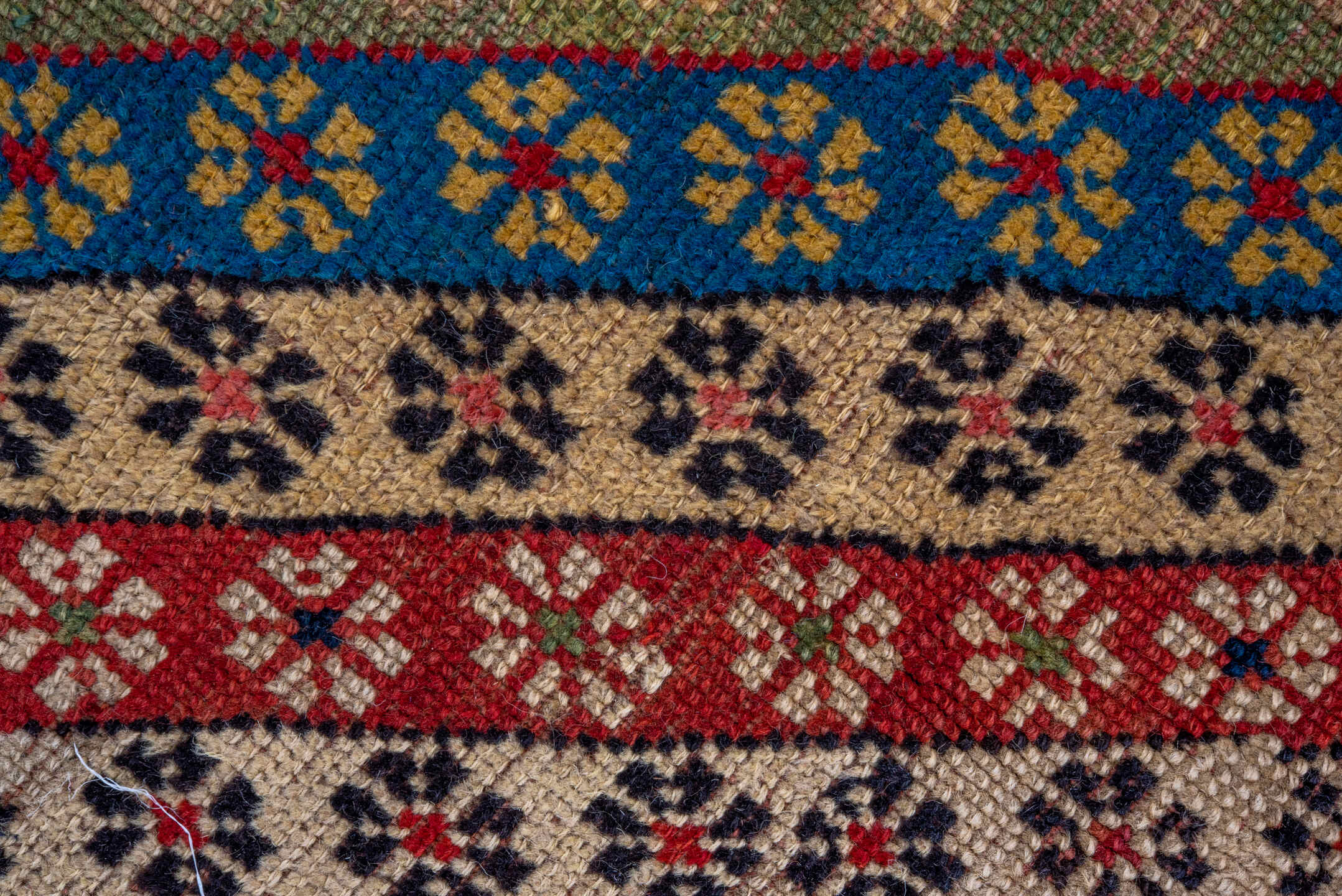 4' x 8' one-of-a-kind handmade antique Caucasian runner rug. Color palette: ivory, rust, indigo, camel, rose, navy, sage