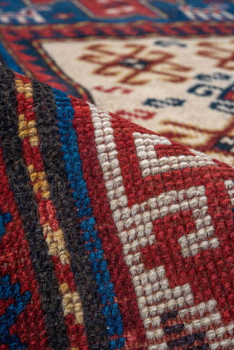 3' x 6' one-of-a-kind handmade antique Kazak runner rug. Color palette: blue, ivory, red, navy, rust, teal, brown